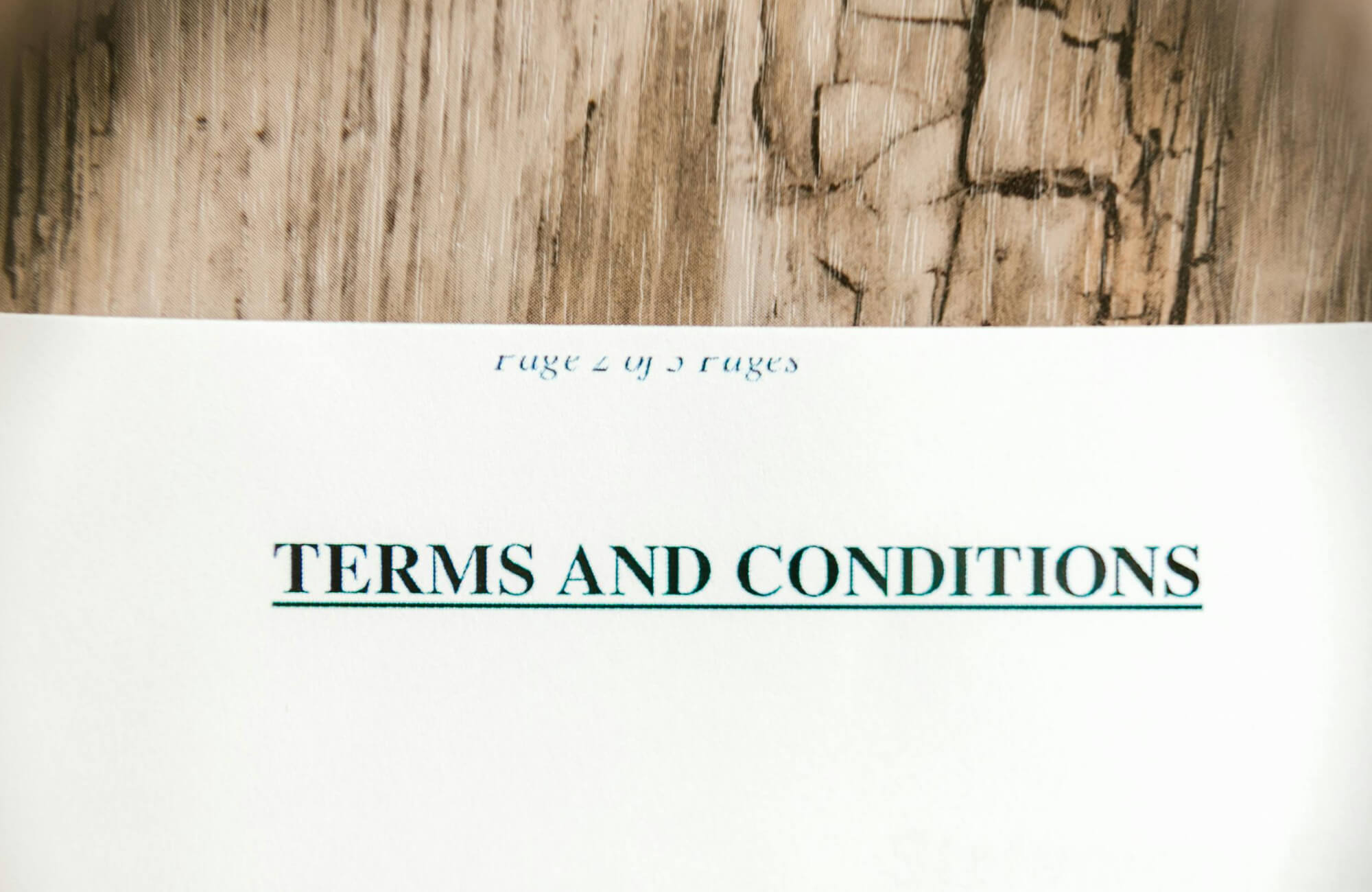 null A close-up of a printed “Terms and Conditions” document suggests reviewing contracts and agreements, an important step when finalizing details for a professional bathroom renovation.
