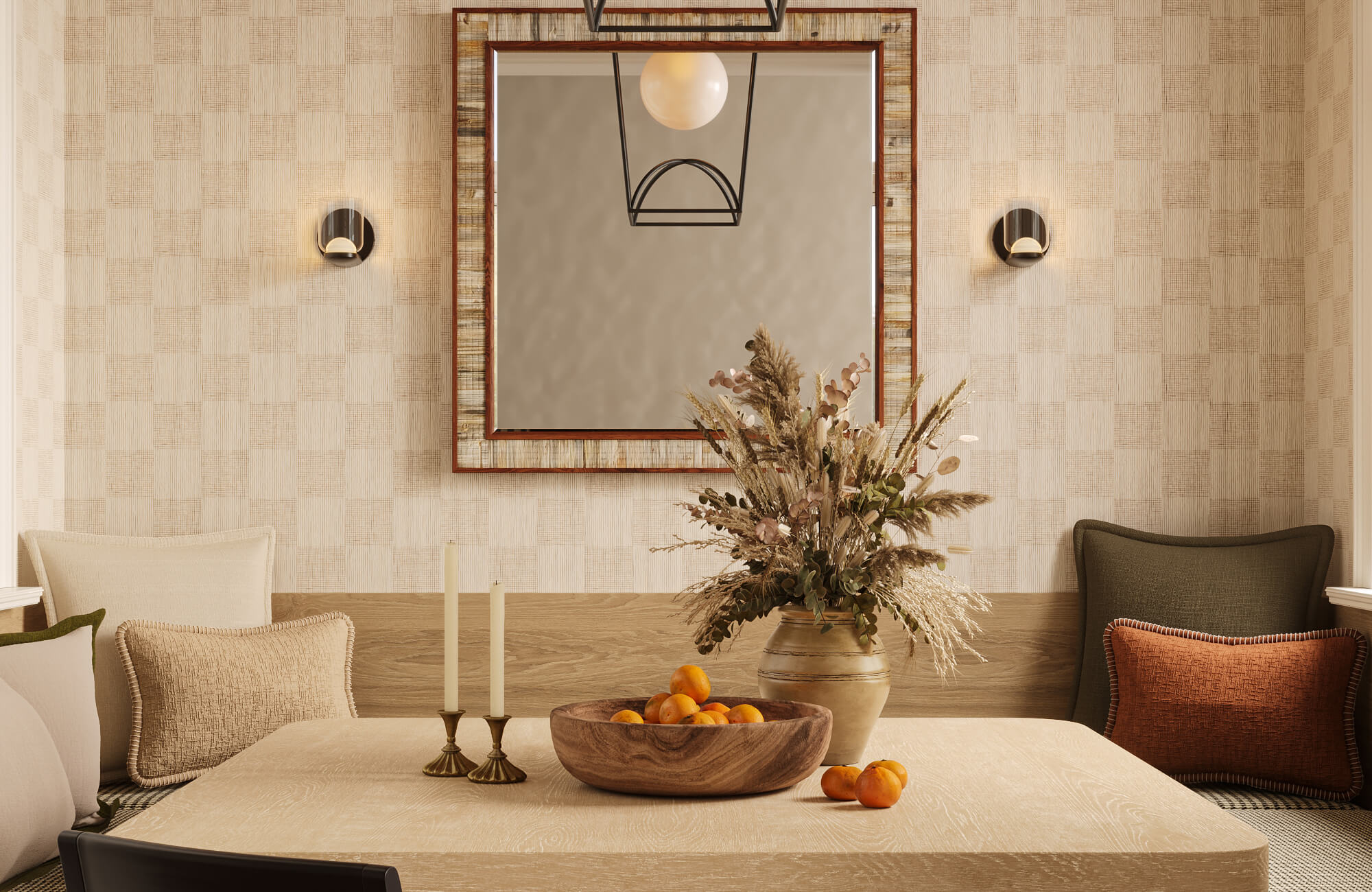 null A large ceramic vessel filled with dried botanicals serves as the focal point of a dining table beneath a framed mirror and layered lighting.