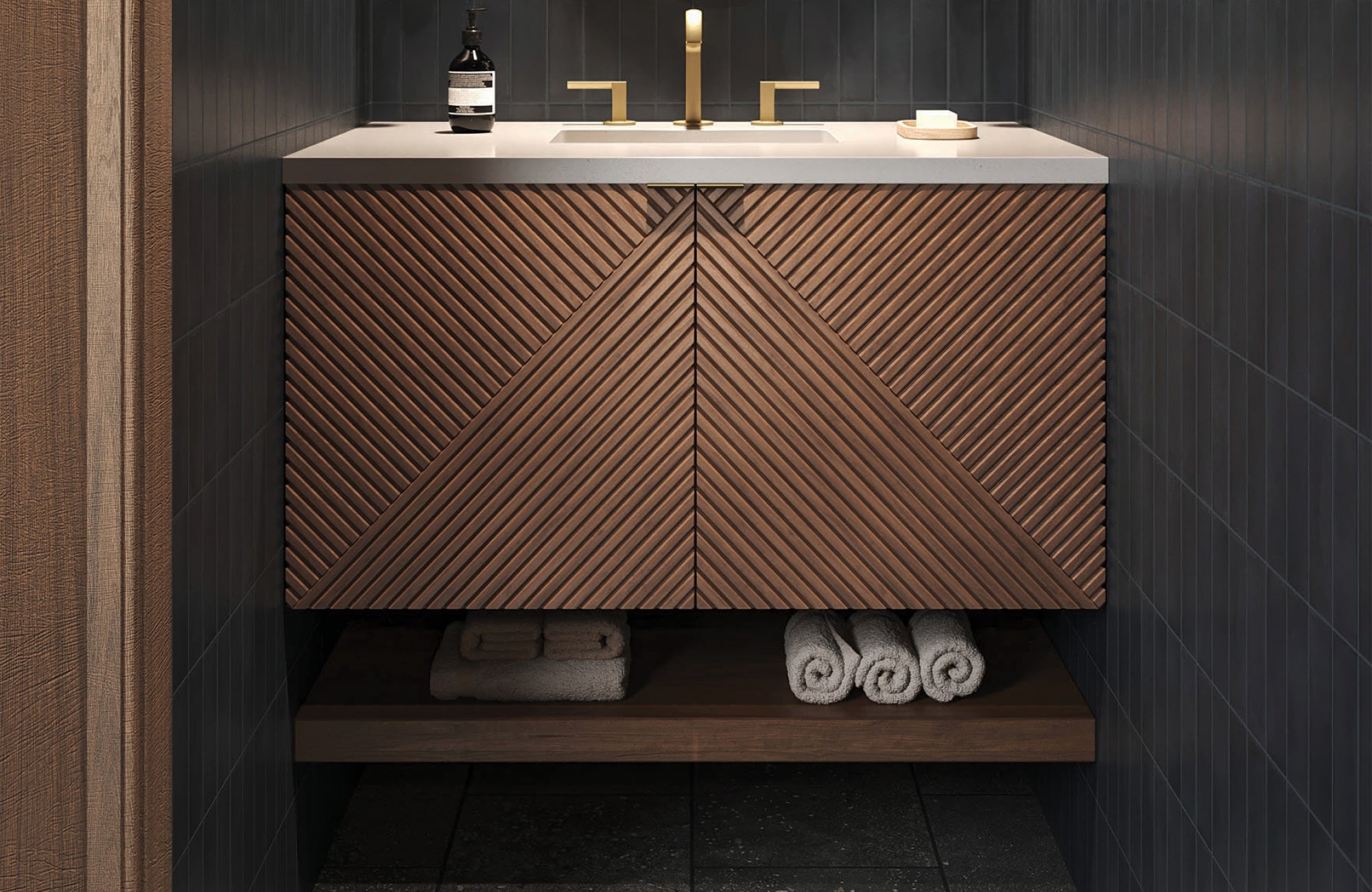 null Sleek vanity with geometric wood pattern doors, white countertop, and open lower shelf, styled in a dark tiled bathroom.