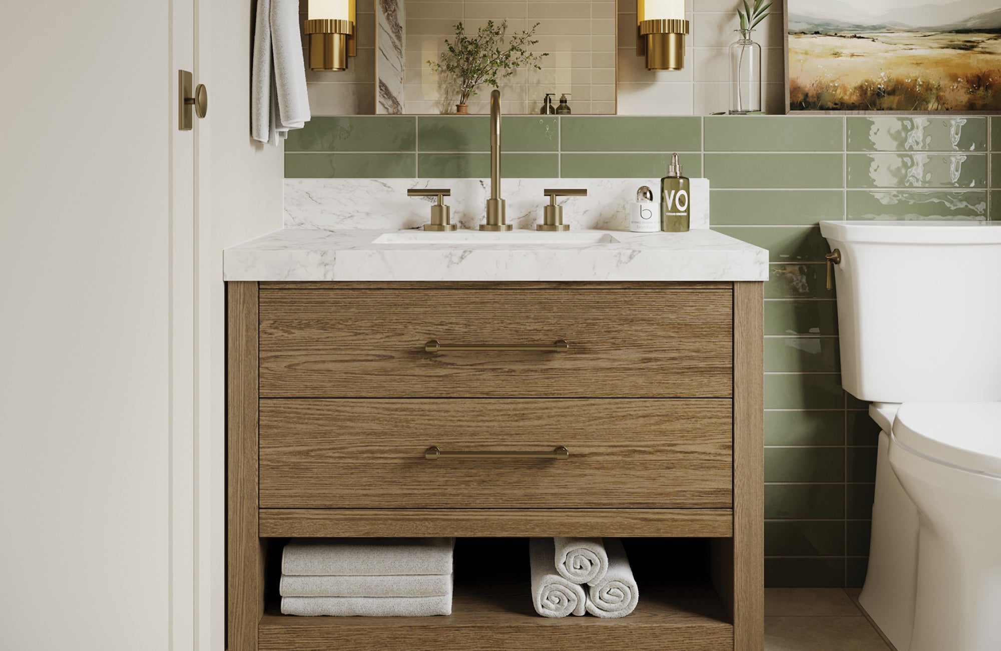 null Veneer vanity with marble top, two drawers, and open shelf, styled with towels in a bathroom with green tiled walls.