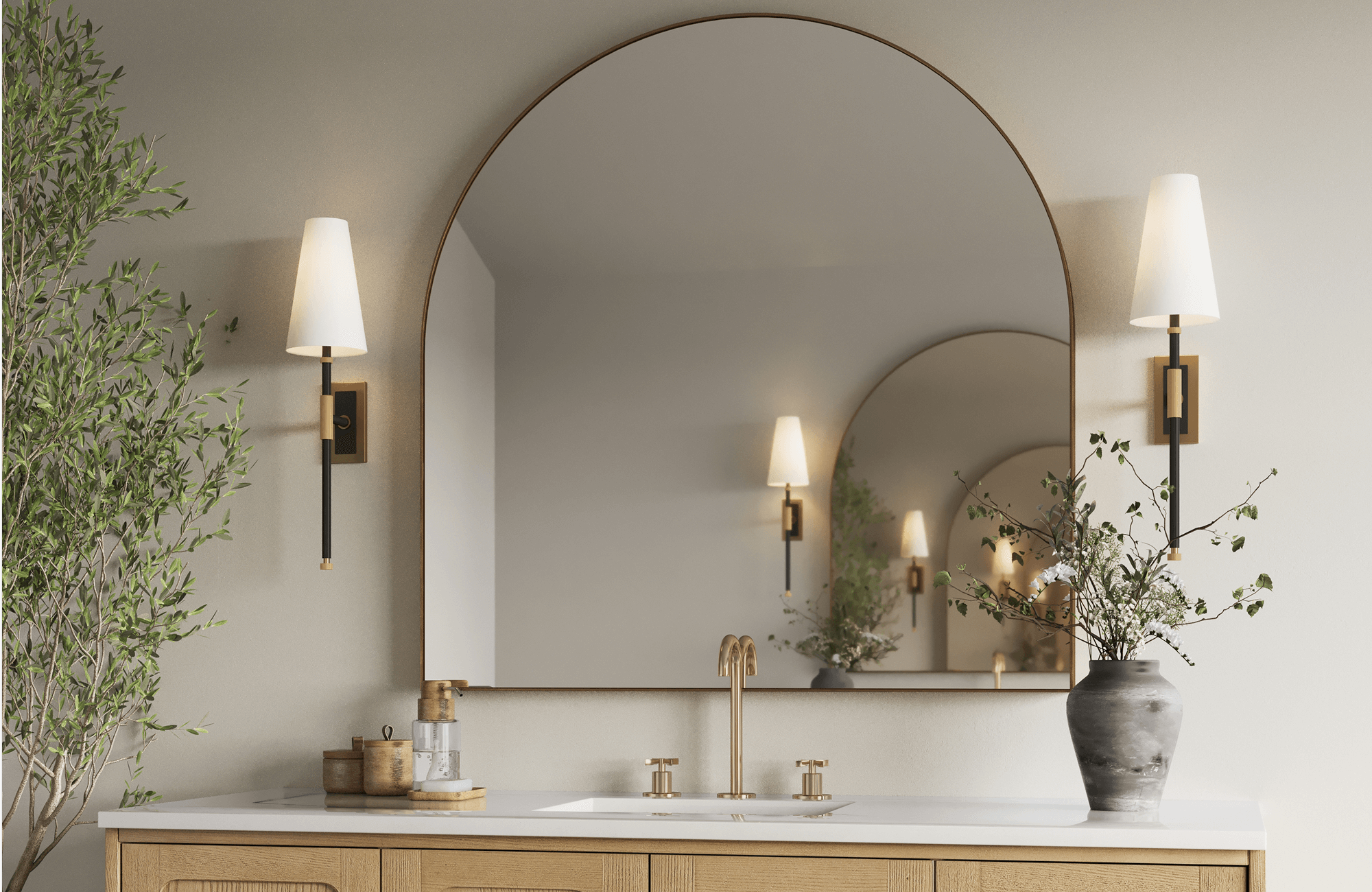 null Charming bathroom with a large bathroom mirror in an organic gold frame, reflecting natural light against teal square tiles and a wooden vanity.