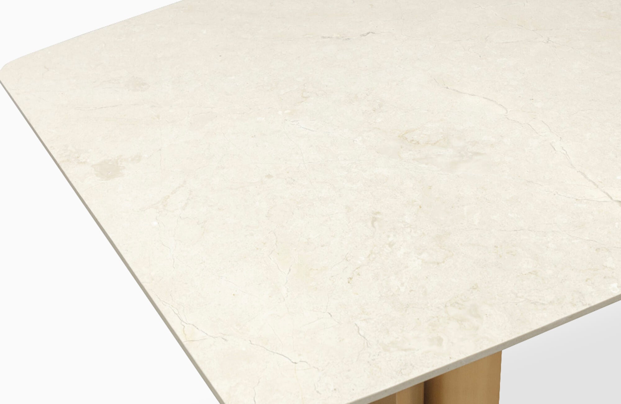 null Close-up of a rectangular marble tabletop with soft beige veining and a smooth polished surface, supported by a gold-toned base.