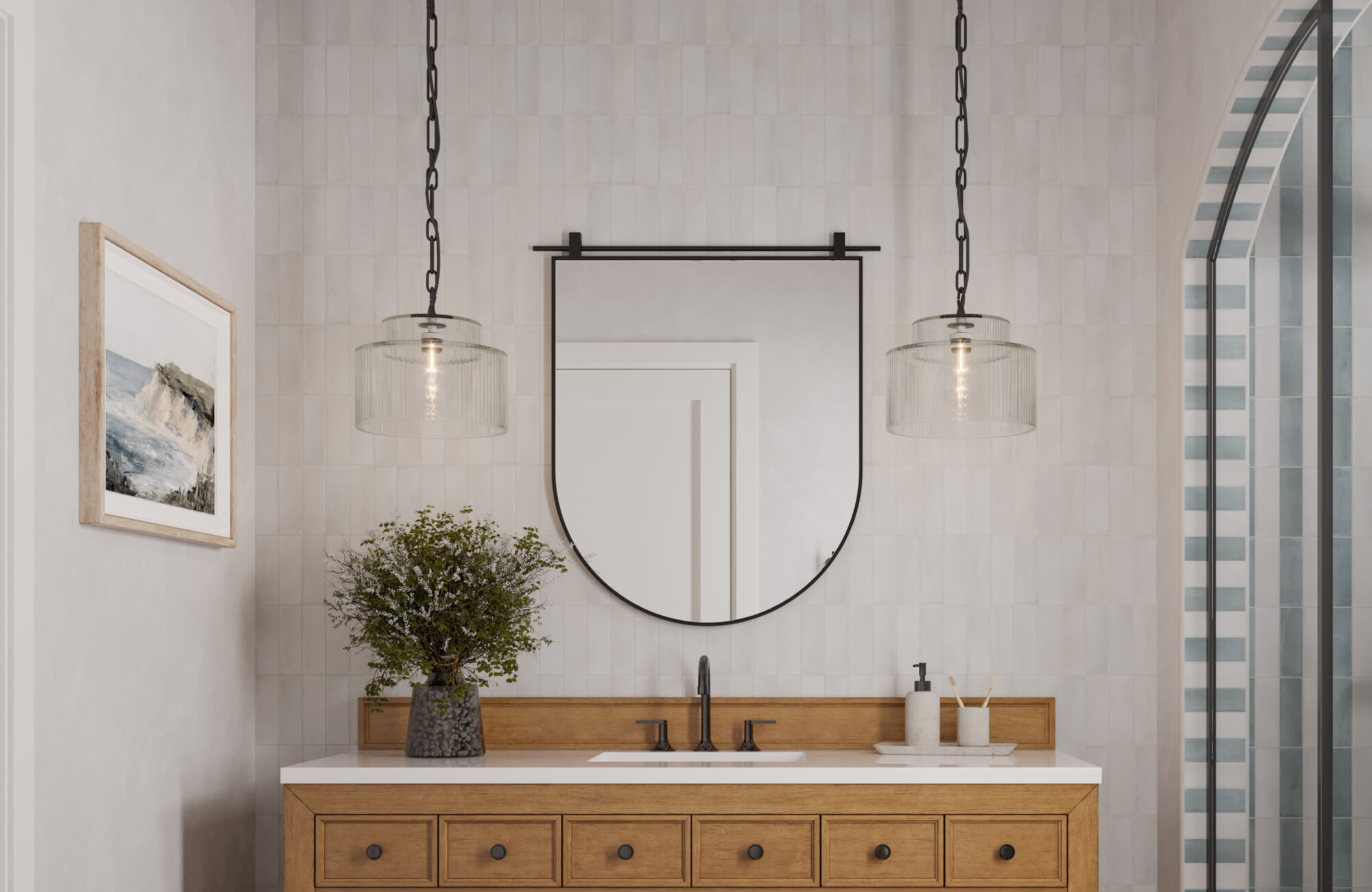 Modern bathroom featuring a half-arched mirror framed in black metal, flanked by glass pendant lights above a warm wood vanity with matte fixtures.