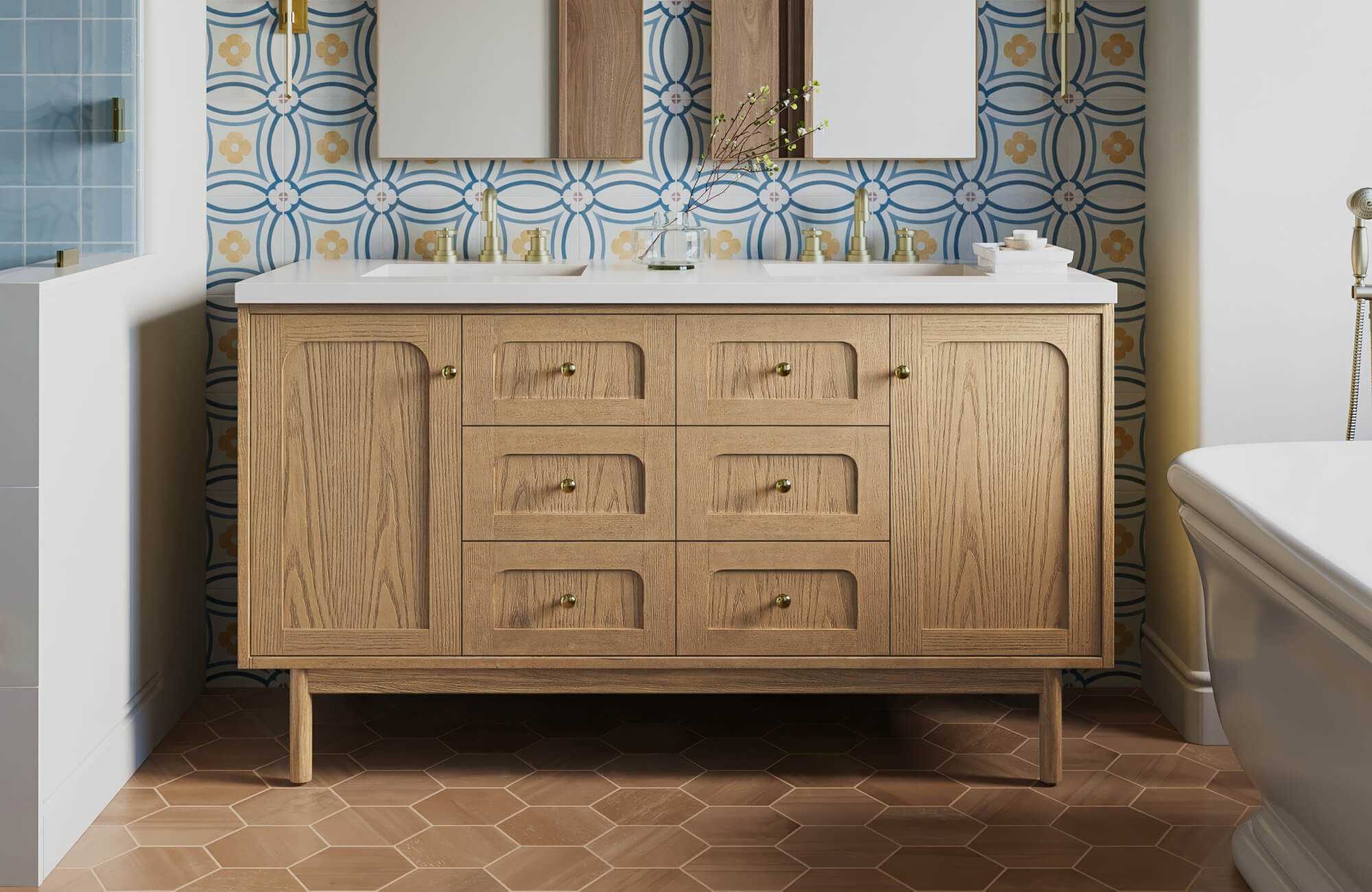 Charming 60 inch double vanity with light natural wood cabinetry, classic brass hardware, and a clean white countertop, set against a bold patterned tile backsplash that adds vintage character and visual depth to the bathroom.