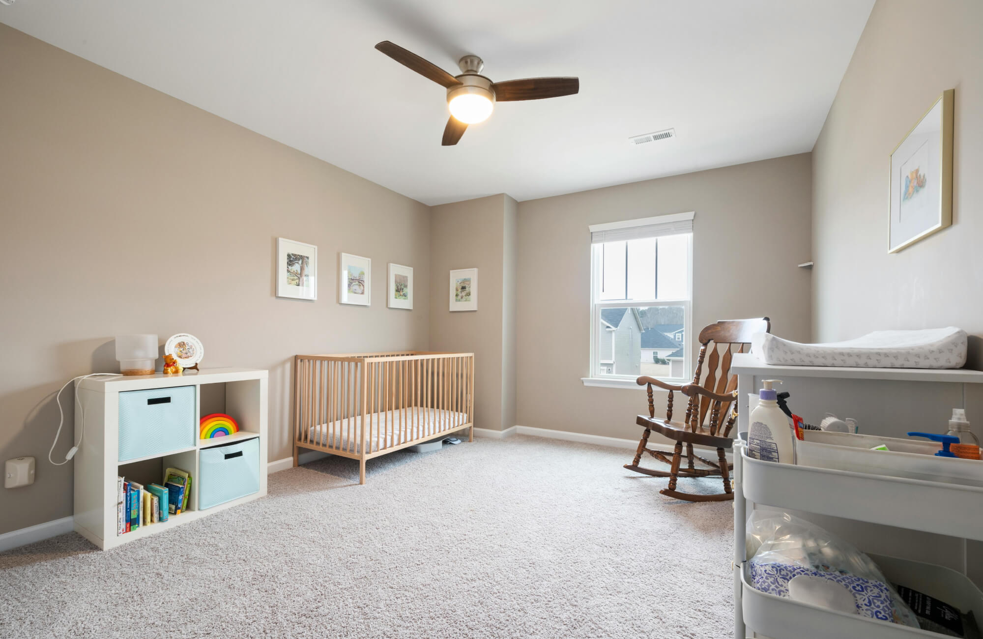 Large open nursery floor shown without a rug, highlighting how room dimensions influence future rug size and placement.