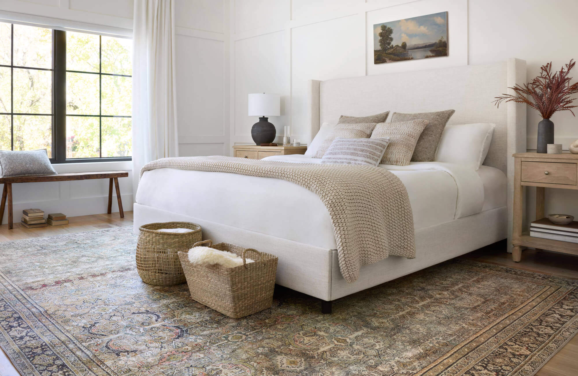 null Layered bed pillows in large and medium sizes create balanced depth while keeping the bed arrangement structured and inviting.