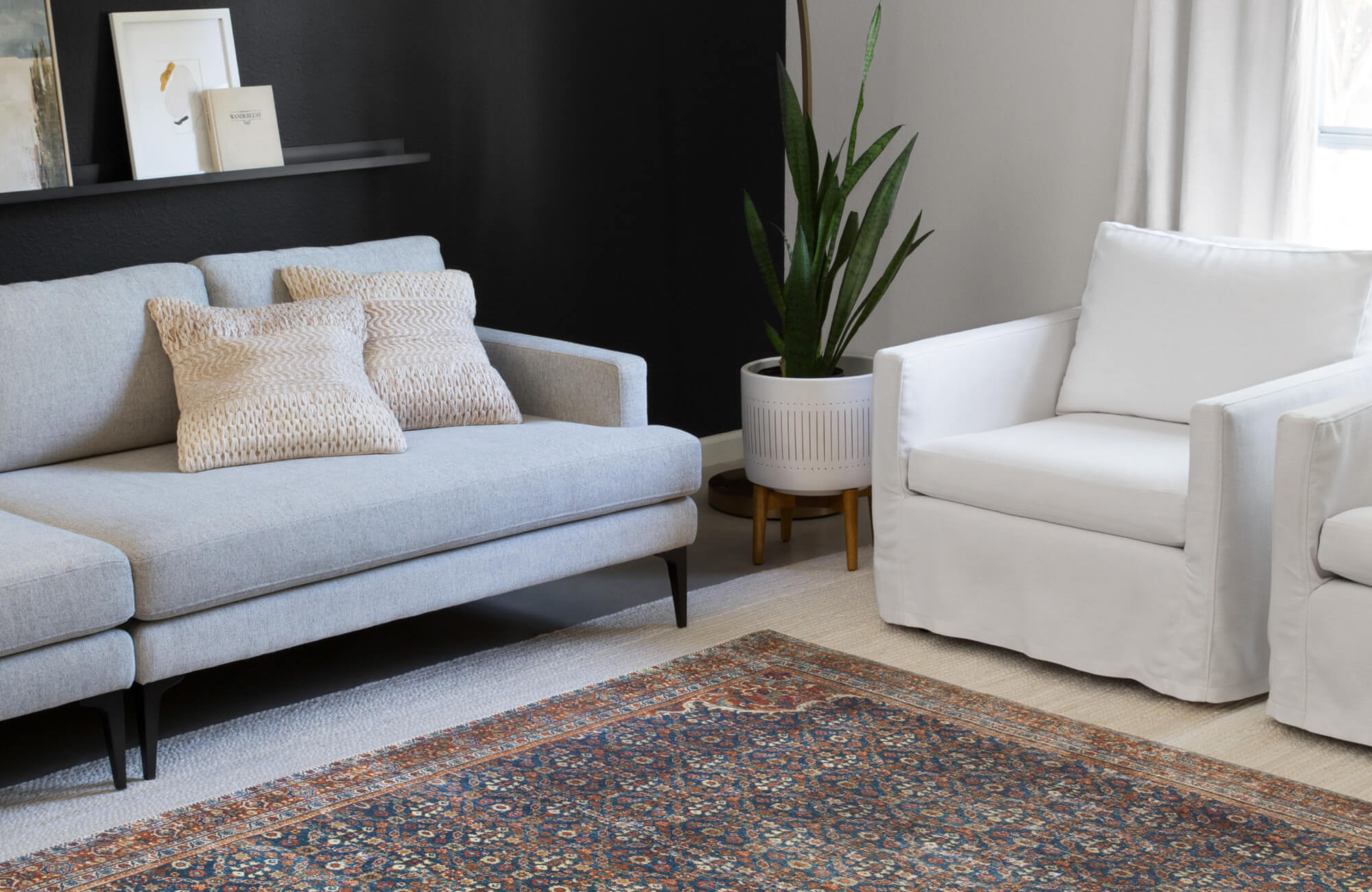 null Two medium square pillows sit comfortably on the sofa, providing support without overcrowding the seating arrangement.