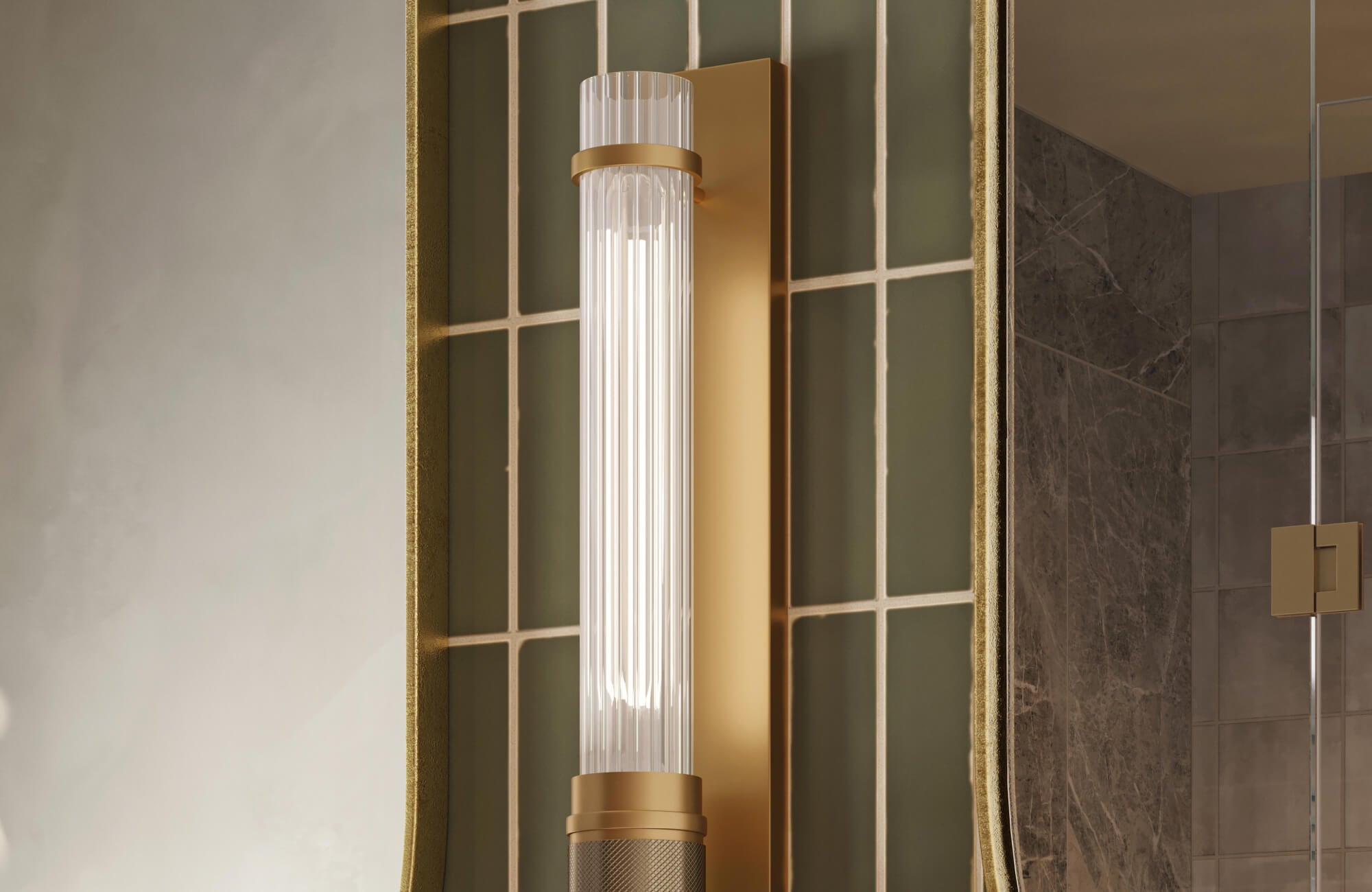 null Vertical wall sconce with a ribbed glass shade and brass frame mounted beside a bathroom mirror.