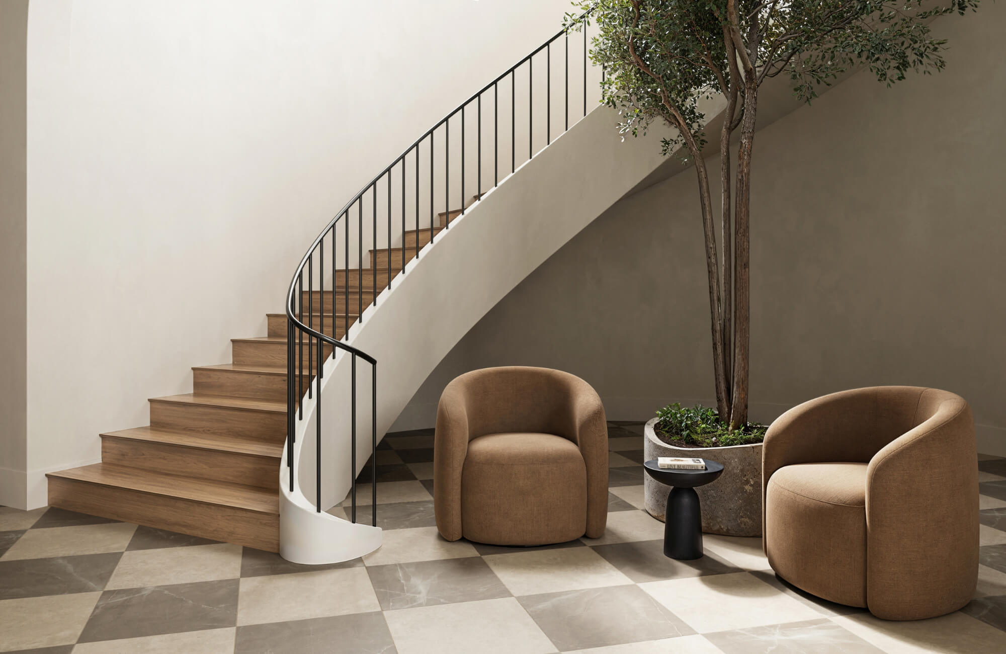 Modern foyer with a neutral checkerboard floor, a curved wooden staircase, minimalist brown armchairs, a black side table, and a potted tree.