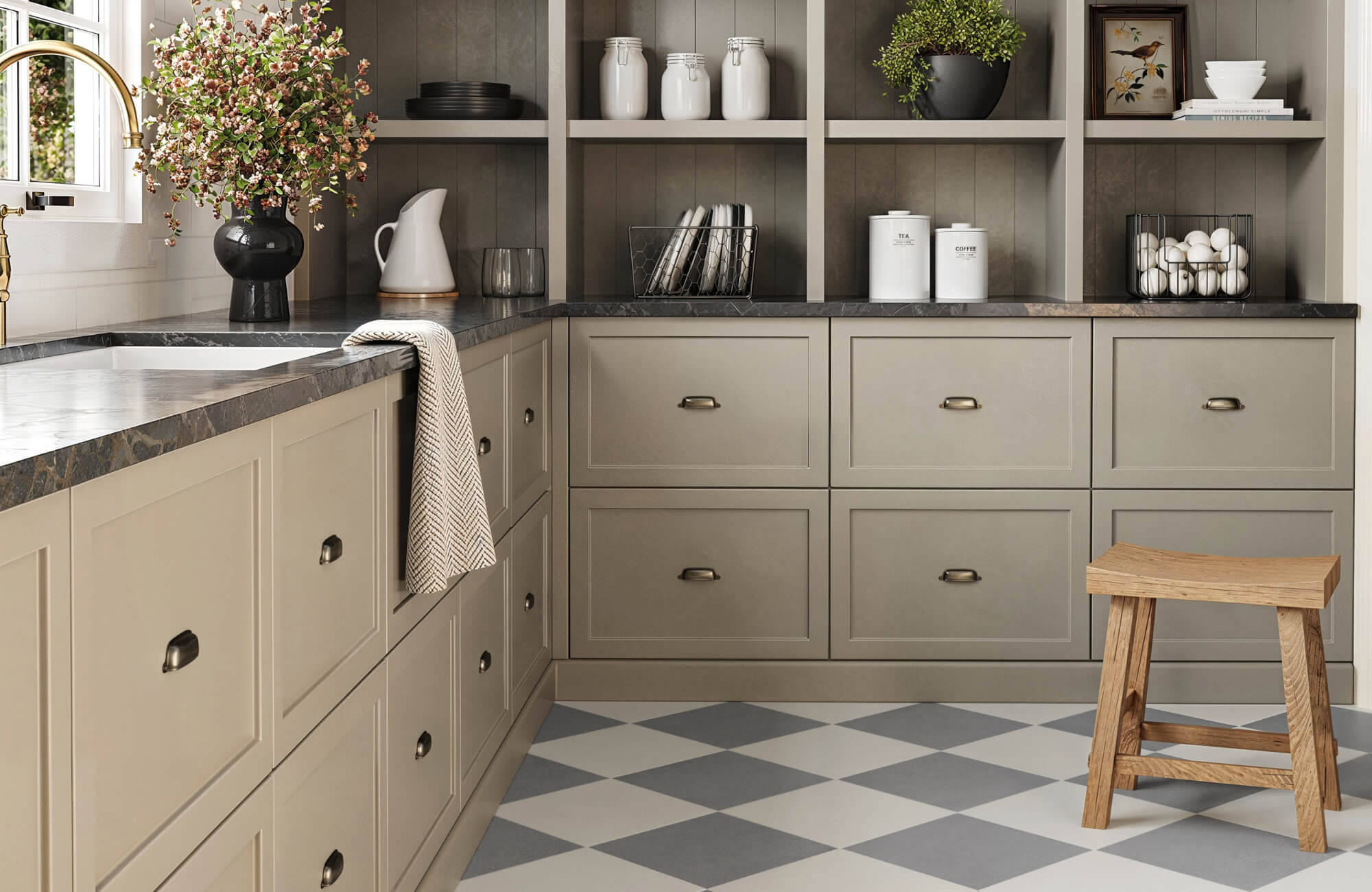 null Traditional kitchen with gray and cream checkerboard tile flooring, shaker-style cabinets, dark countertops, and a wooden stool by the sink.