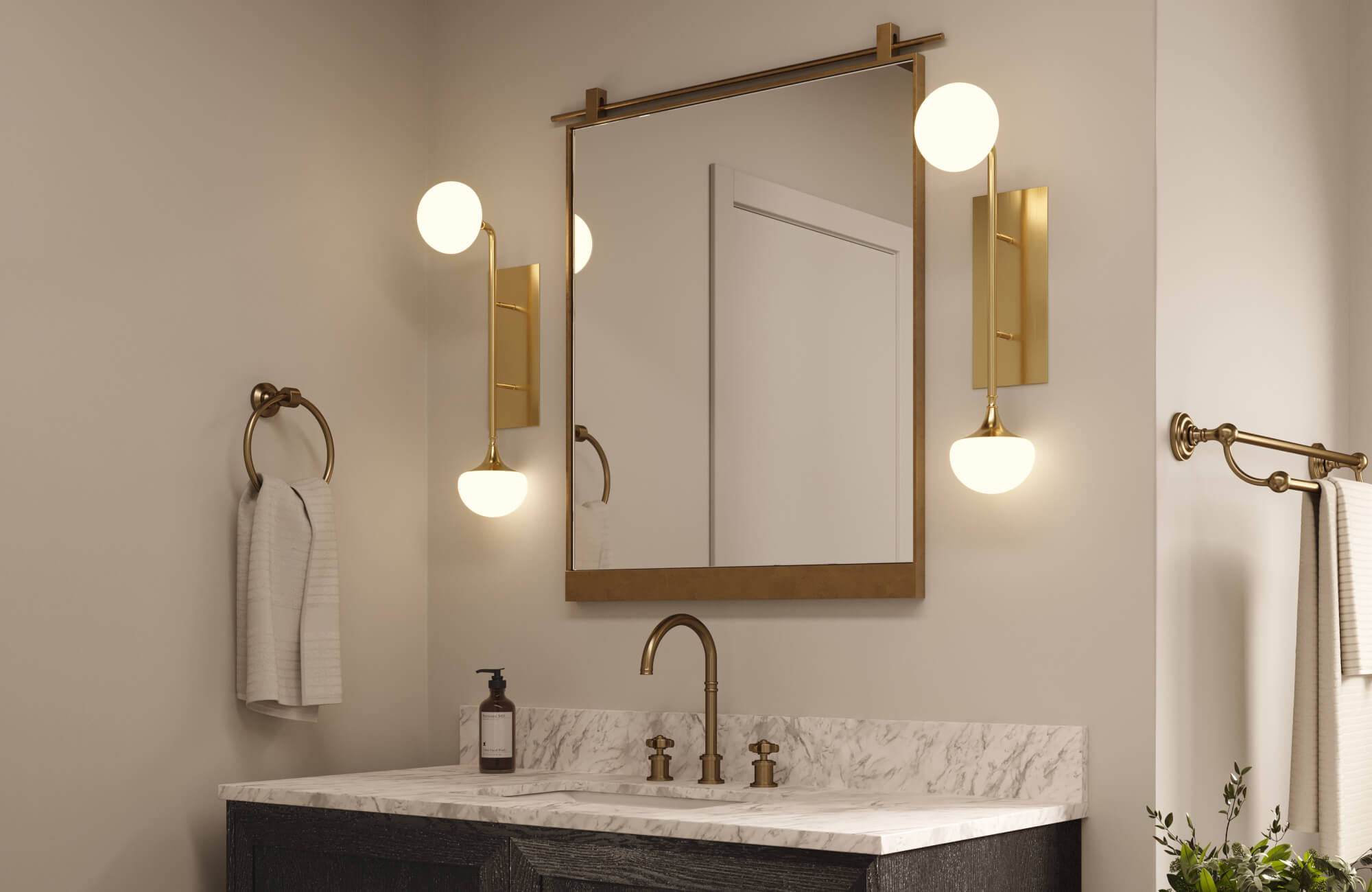 Modern bathroom vanity with marble countertop, brass fixtures, and globe sconces flanking a rectangular mirror.