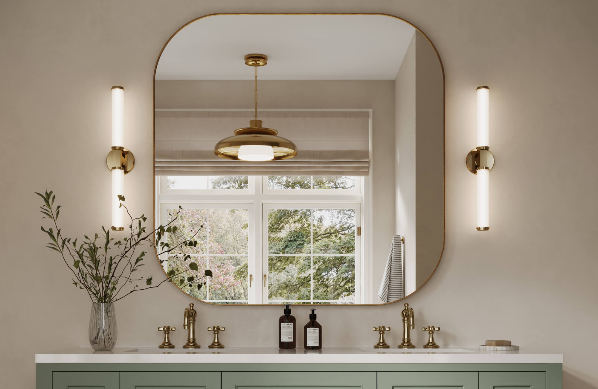 Serene bathroom with sage green vanity, brass fixtures, and a large arched mirror framed by sleek vertical sconces.