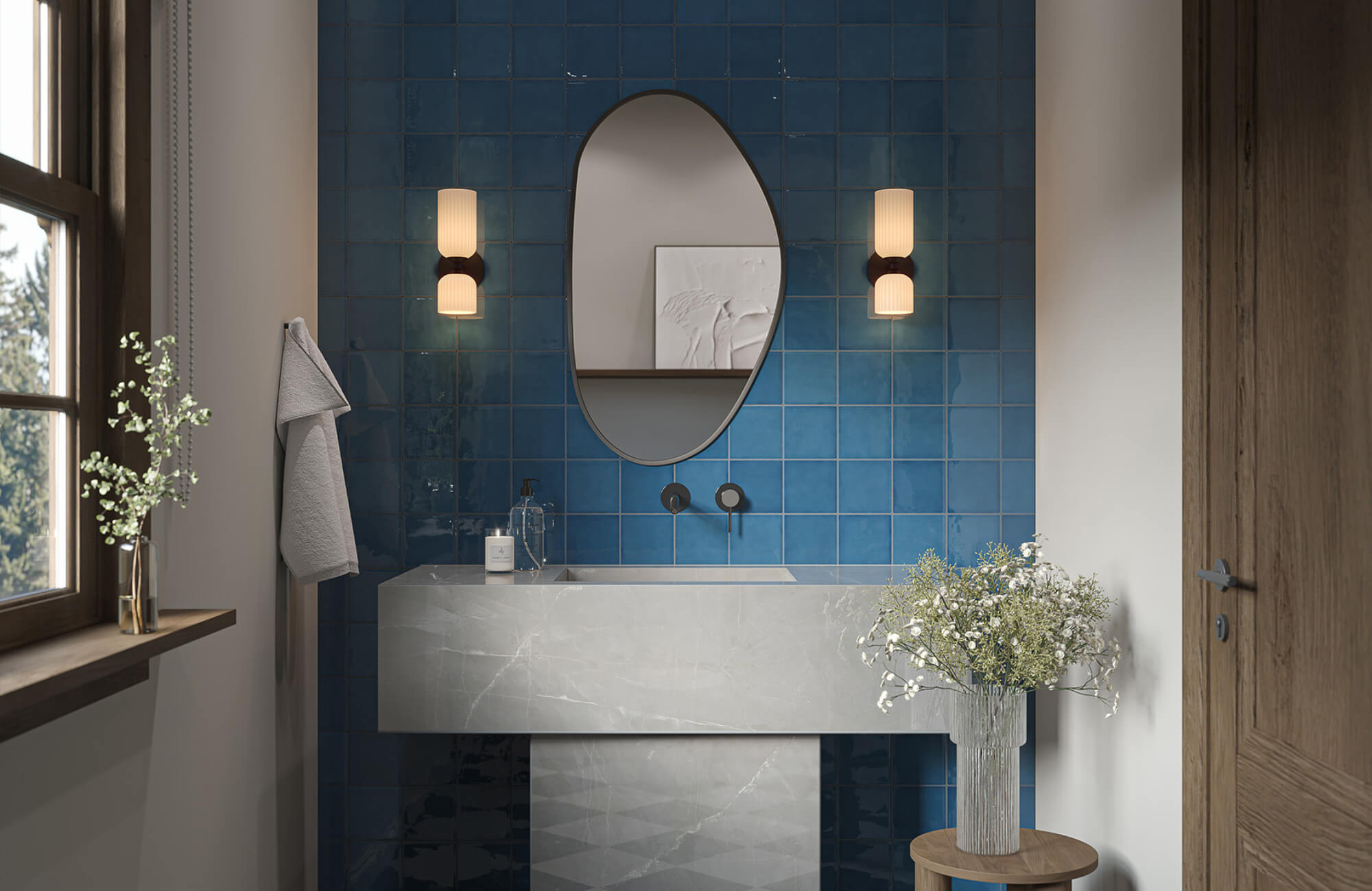 Bathroom vanity with an oval mirror opposite a window, illustrating balanced lighting and reduced glare through placement and wall color.
