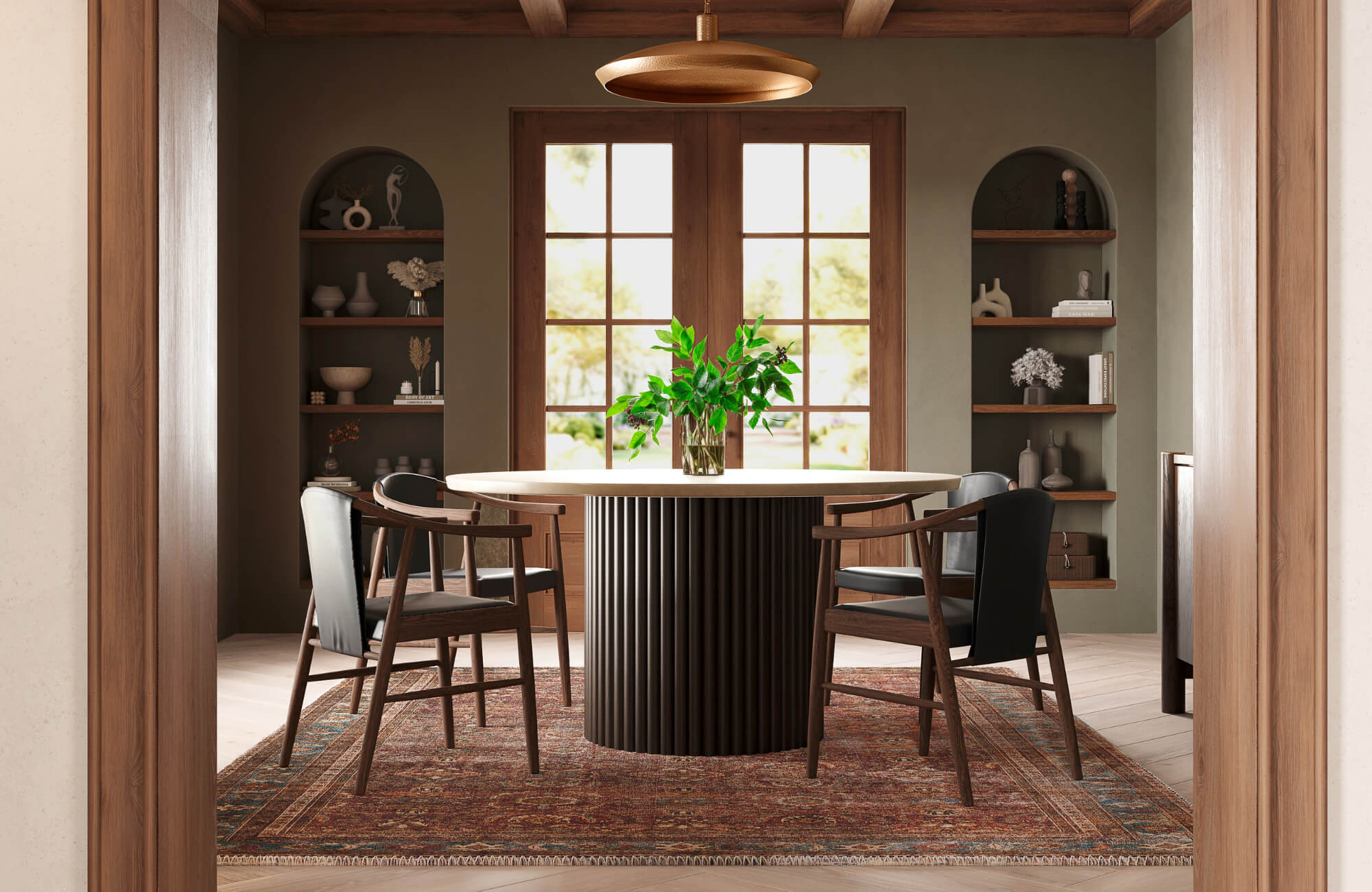 Black dining chairs combined with warm wood tones, a patterned rug, and greenery to balance contrast and add visual warmth to the room.