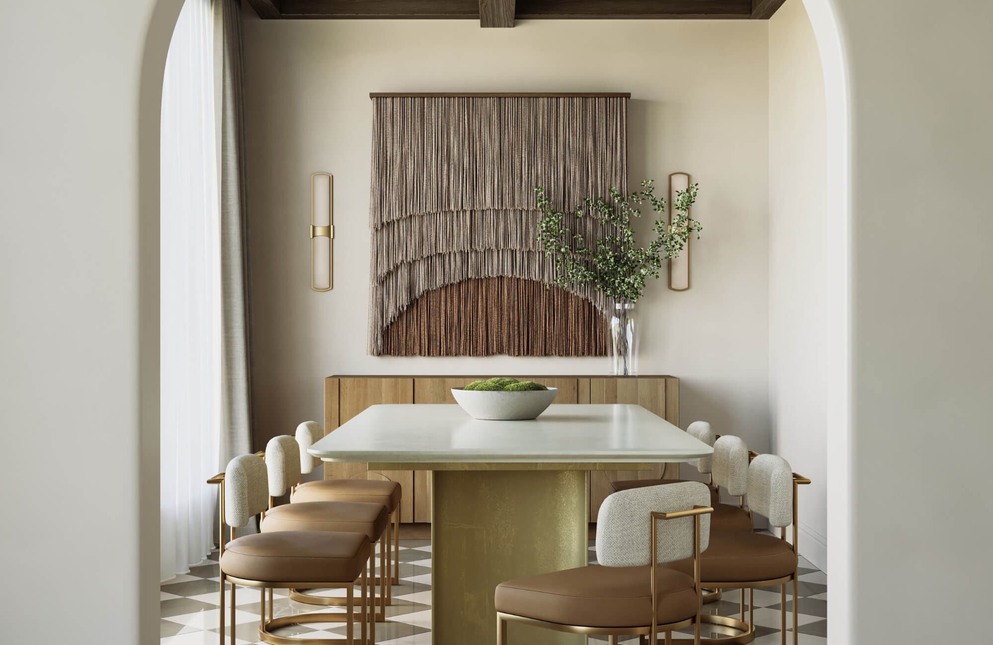 Neutral-toned dining room featuring a long rectangular table, upholstered chairs, textured wall art, and soft natural light.