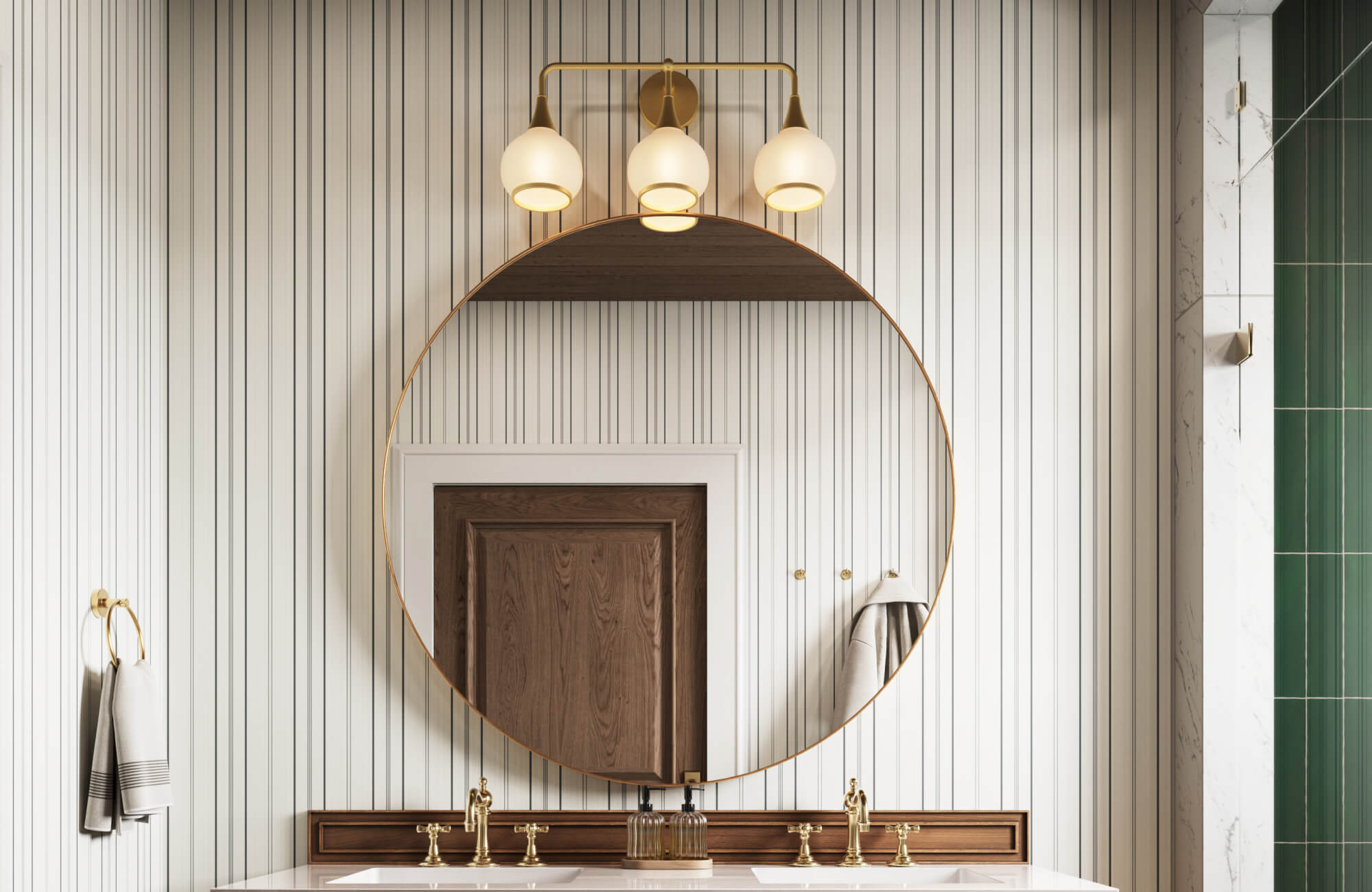 null Contemporary bathroom with vertical striped wallpaper, a large round brass-framed mirror, triple globe vanity light, warm wood vanity trim, brass faucets, and a green tiled shower accented by marble walls.
