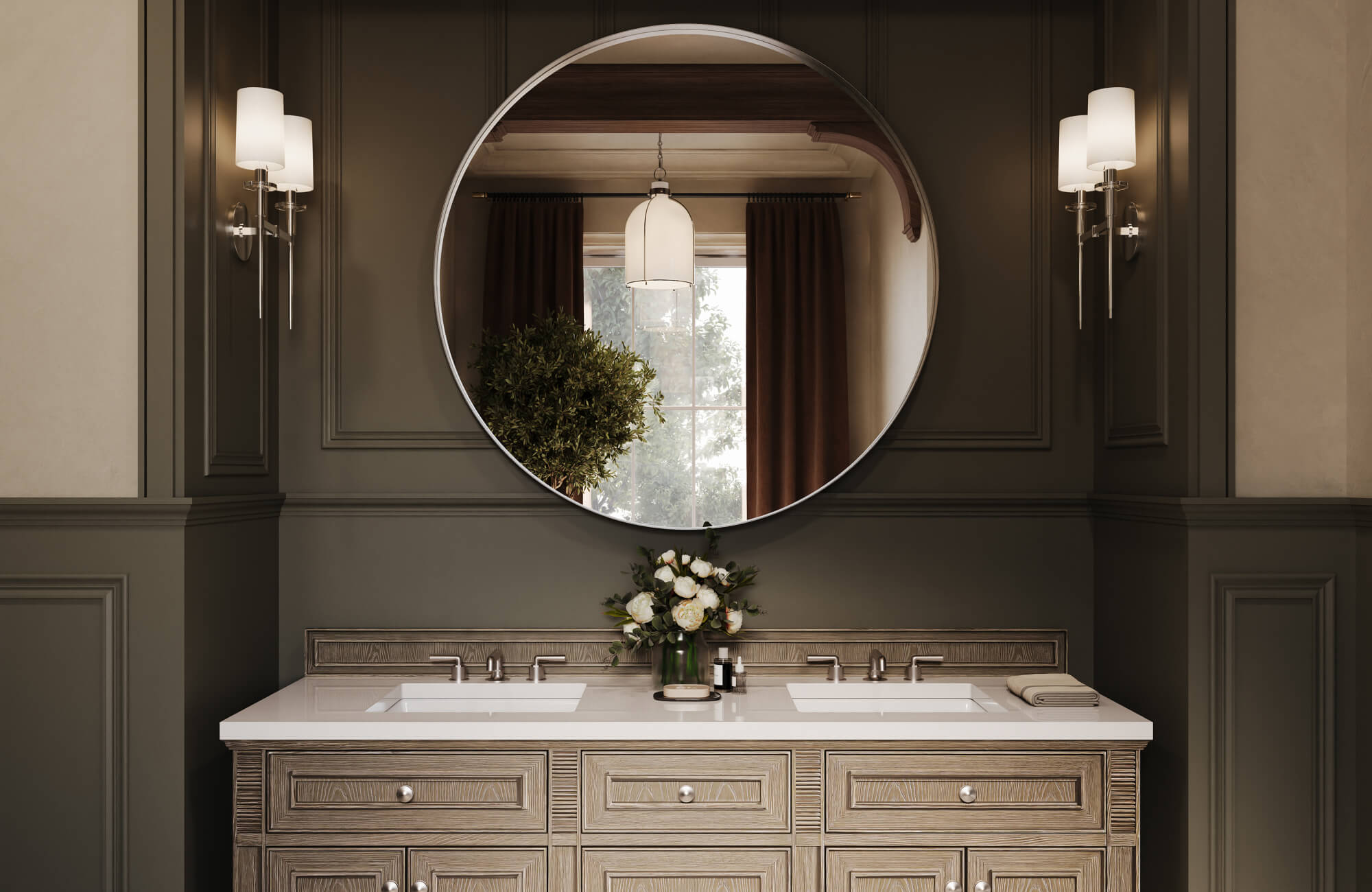 Moody bathroom with taupe wood double vanity, oversized round mirror, and sleek double wall sconces with frosted shades.