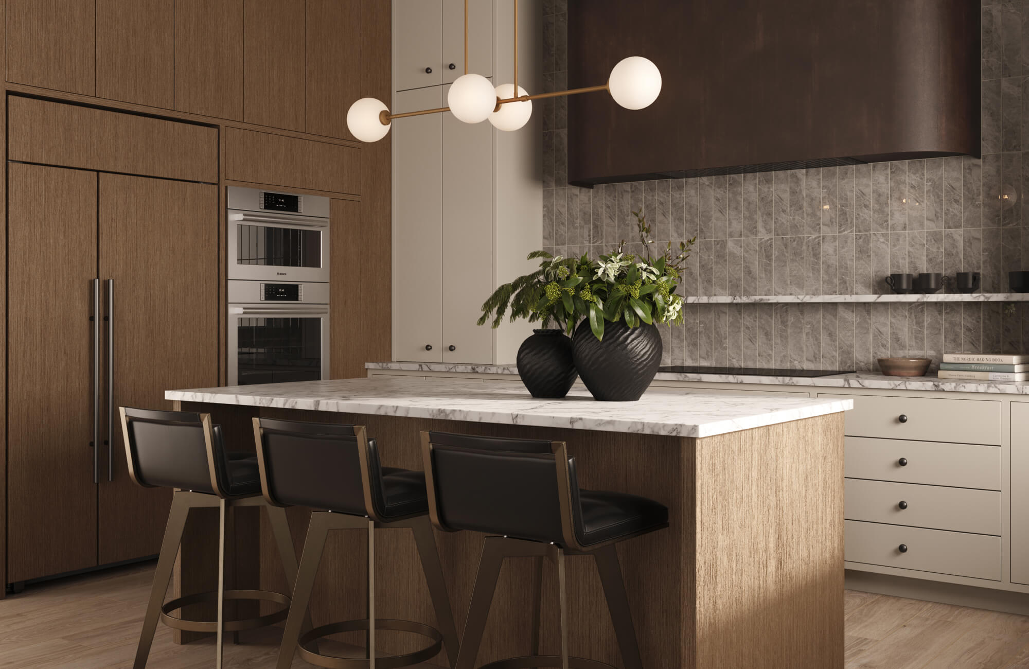 null Modern kitchen island with globe pendant lights suspended above a marble countertop, styled with warm wood cabinetry, light neutral drawers, and upholstered counter stools.