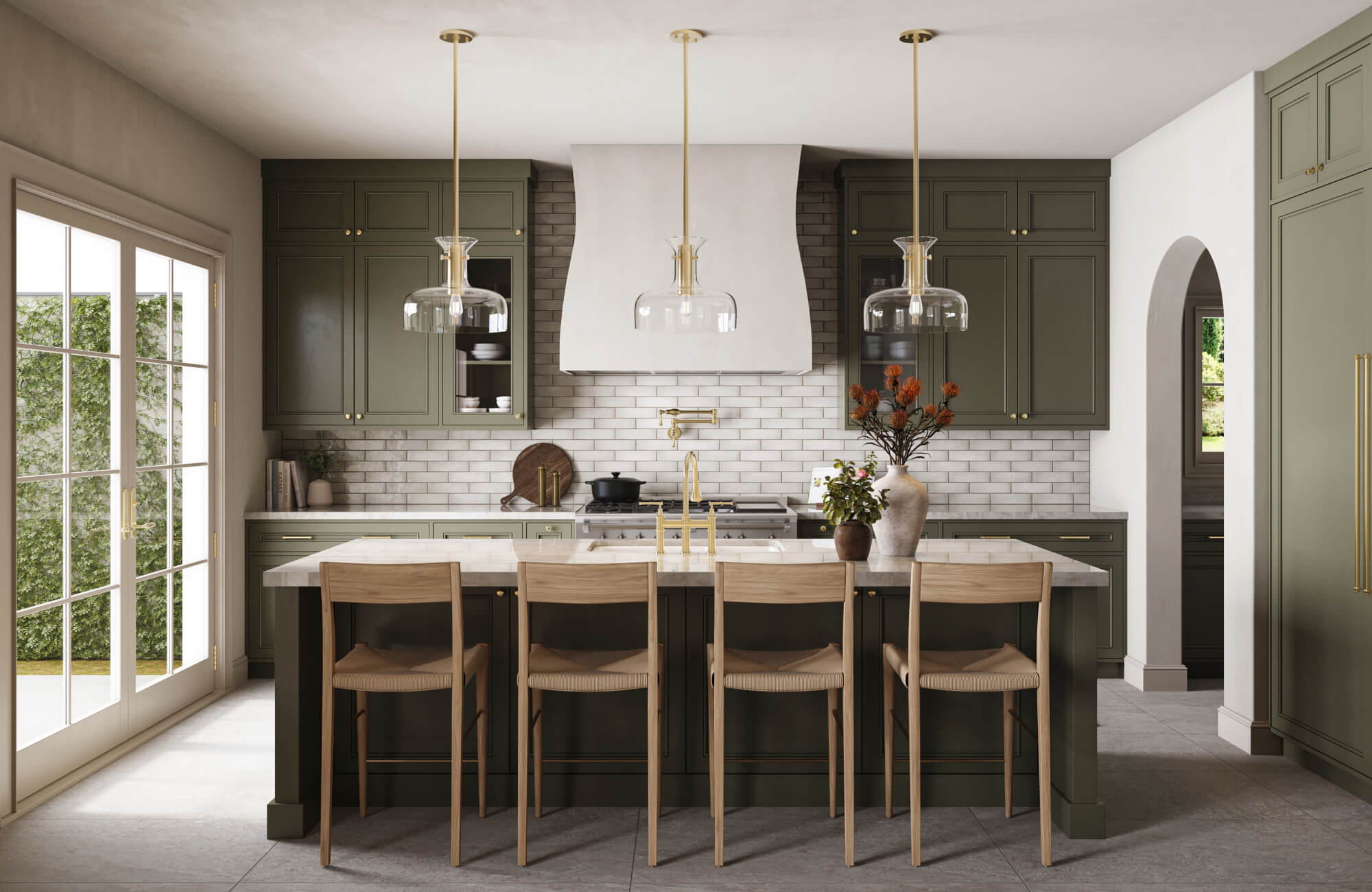 null Kitchen island with three clear glass pendant lights hung at even height above a marble countertop, paired with olive green cabinetry, brass accents, and light wood bar stools.