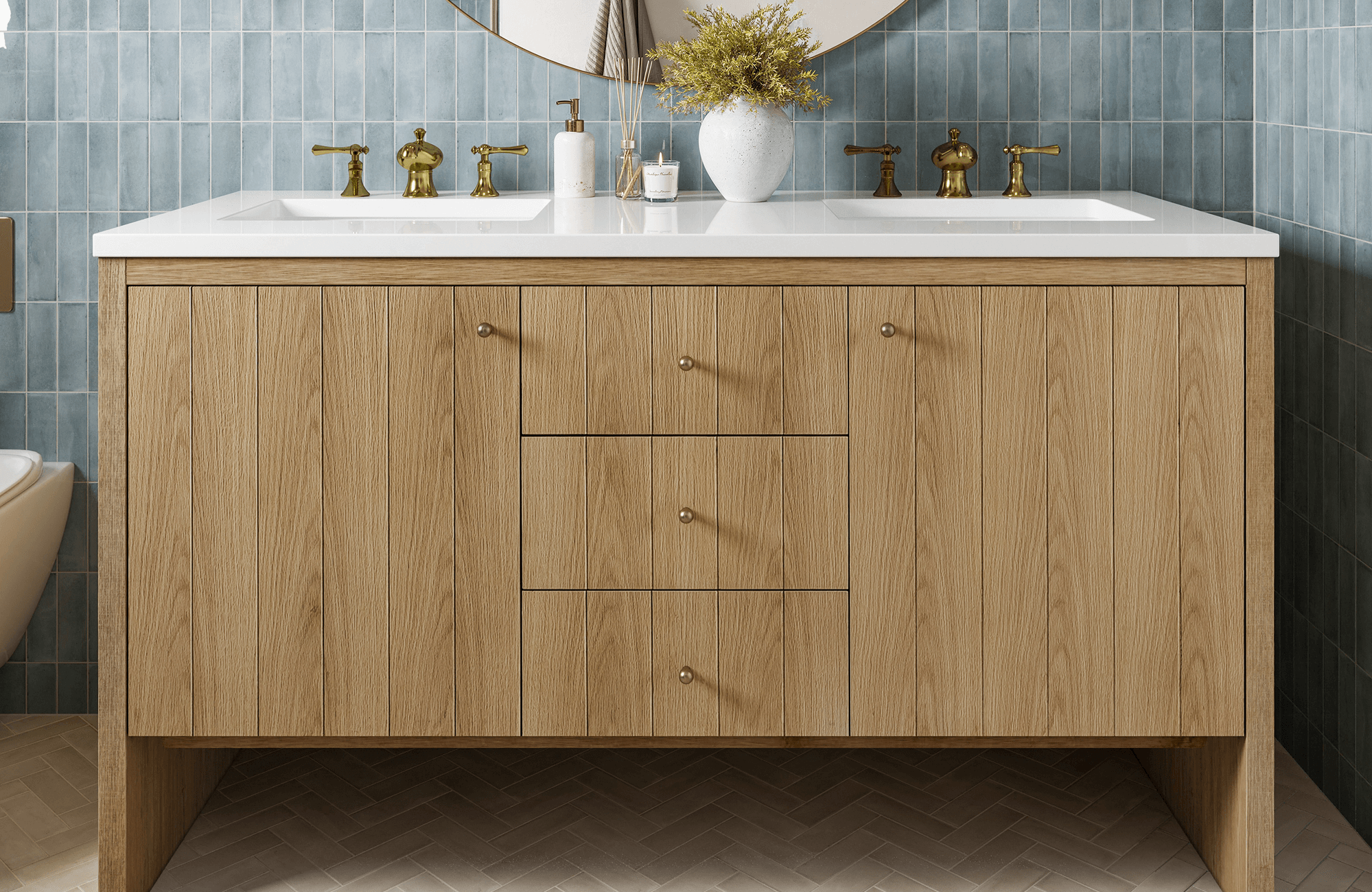 Clean-lined oak vanity with vertical slat fronts, white countertop, and vintage-inspired brass faucets against blue tiled walls.