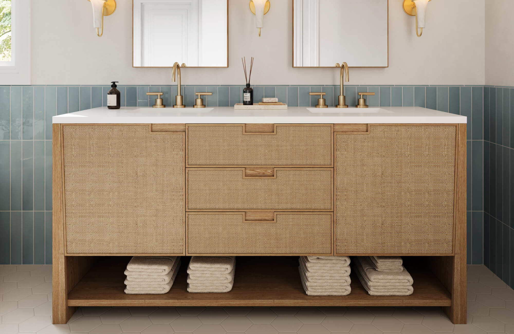 Natural wood vanity with woven cane fronts pairs with brushed gold fixtures and sea-glass blue vertical tiles.
