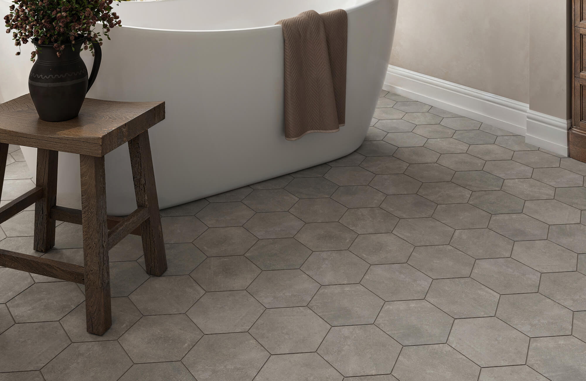 null Hexagonal porcelain floor tiles in a smoky concrete look, blending modern texture with rustic charm for a serene bathroom retreat.