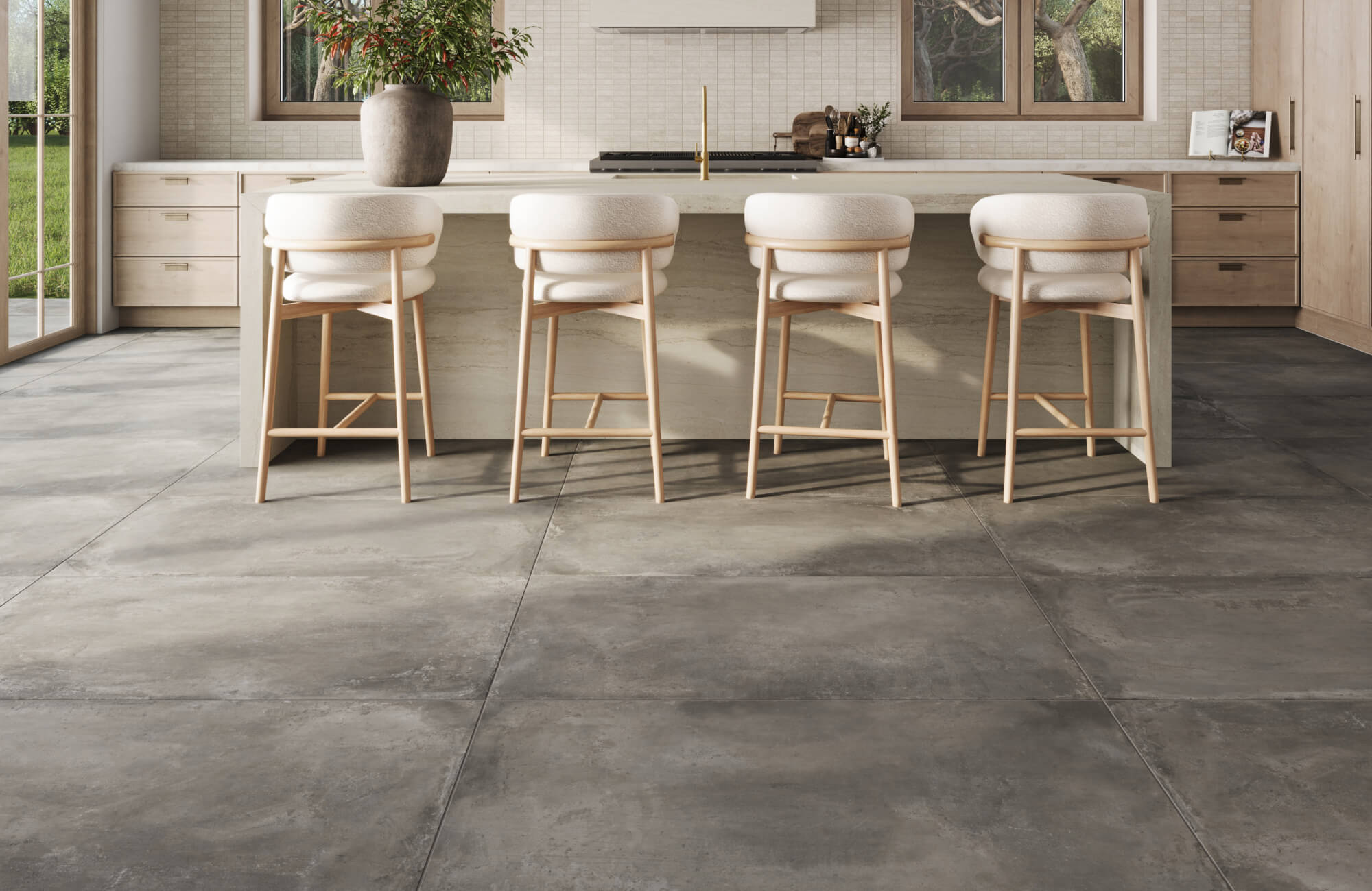 null Large format porcelain tiles with a rich, weathered concrete look anchor this modern kitchen with bold, industrial elegance.