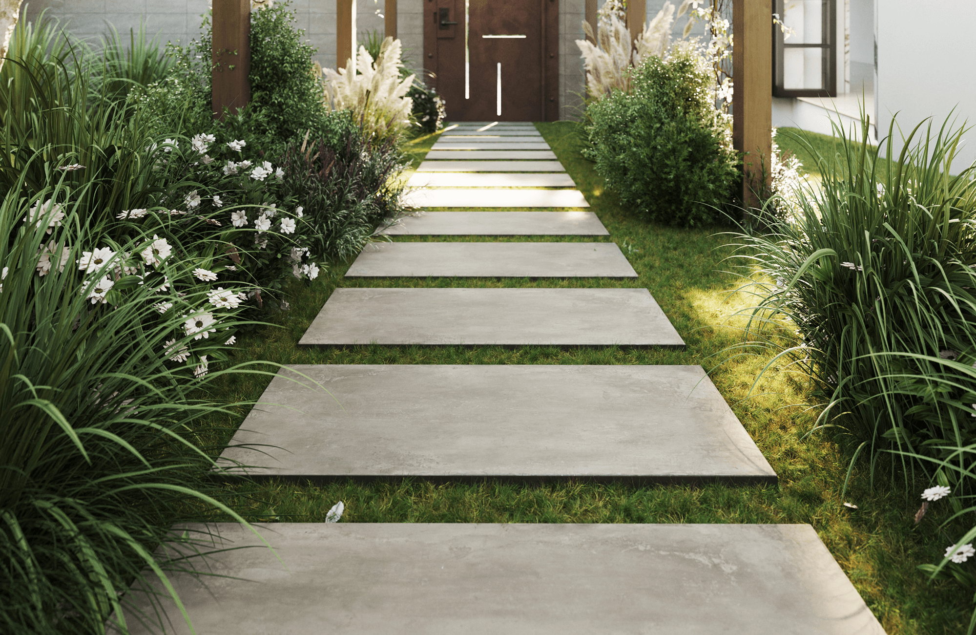 null Rectangular porcelain concrete look pavers create a clean, modern garden path surrounded by lush greenery and white blooms.