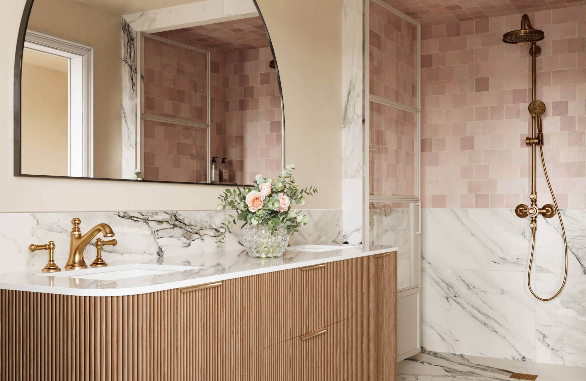 null Elegant bathroom featuring gold fixtures, soft pink wall tiles, and luxurious white marble with bold veining.