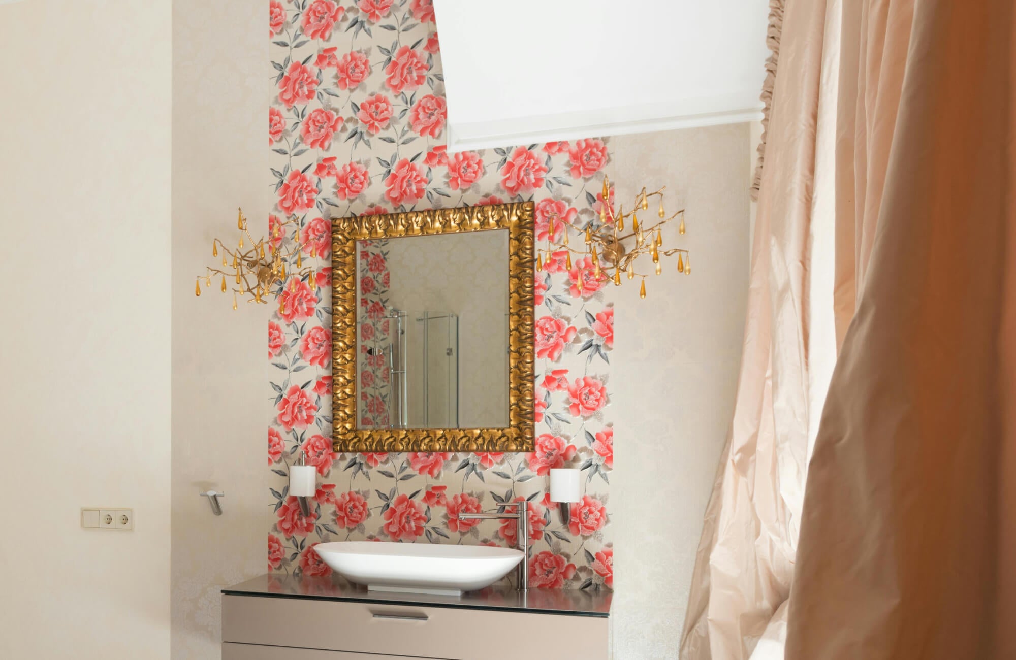 null Peel and stick wallpaper with coral floral pattern creating a decorative accent wall behind a bathroom vanity and mirror.