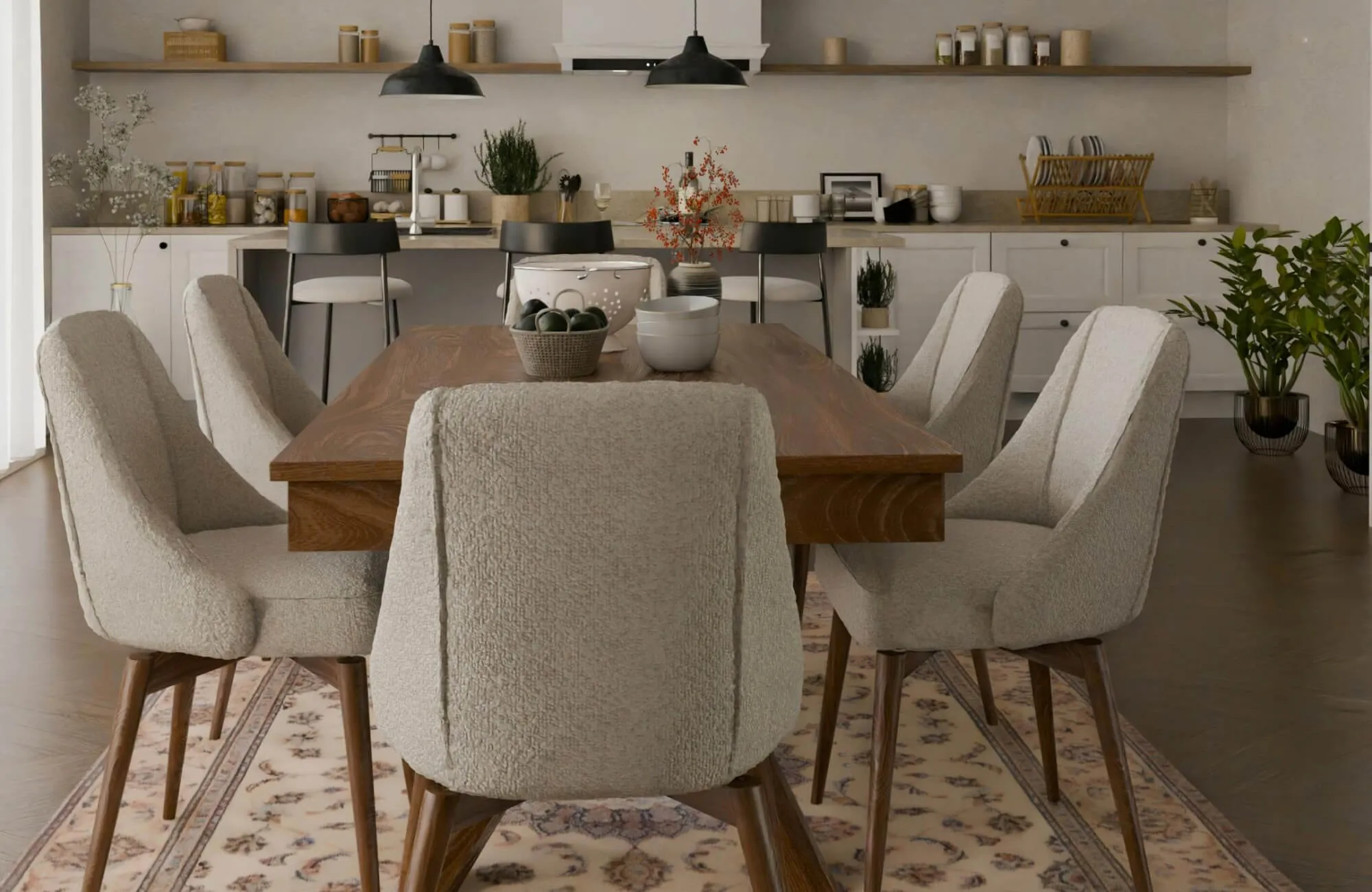 Warm, modern dining area showcasing a solid wood dining room table set paired with soft upholstered chairs, styled against an open-shelf kitchen backdrop with neutral tones, black pendant lighting.