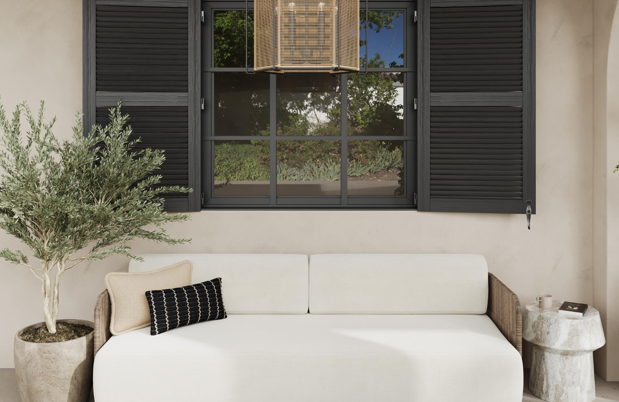 null Minimalist outdoor sofa with two decorative pillows beneath black shutters and a woven pendant light on a serene patio.