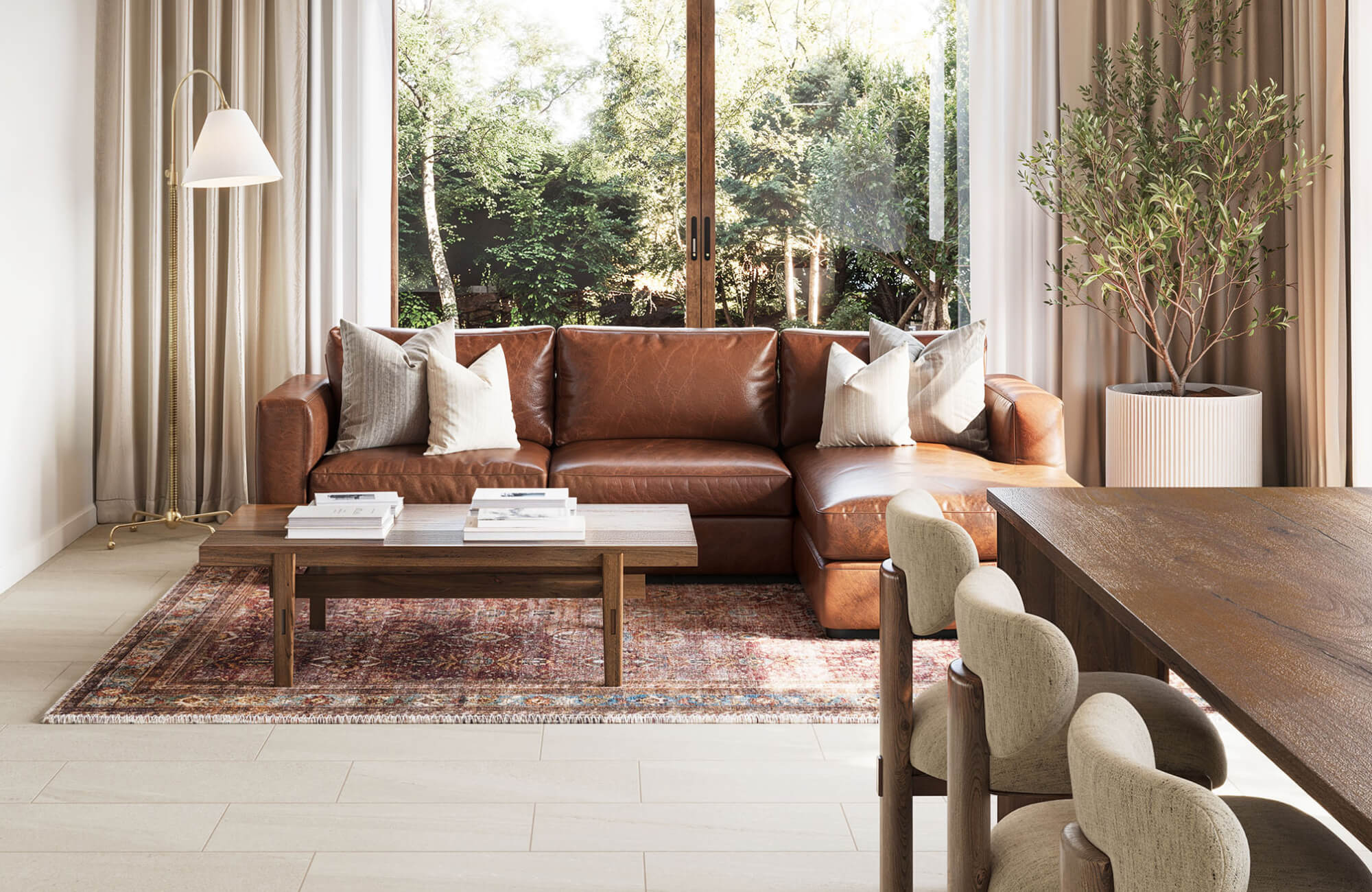 null Leather sectional arranged with four neutral pillows, evenly distributed across both sides.