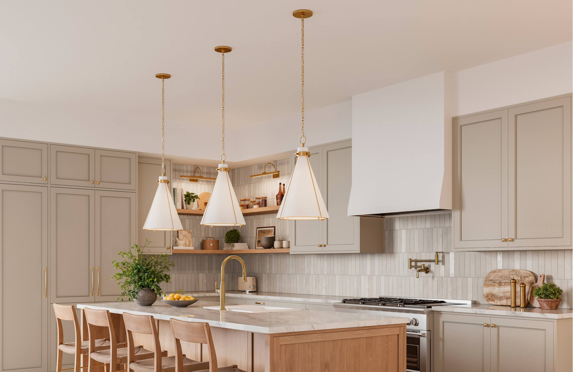 null Cone-shaped pendant lights with gold detailing illuminate a marble island, set against a vertical tile backsplash in warm neutrals.