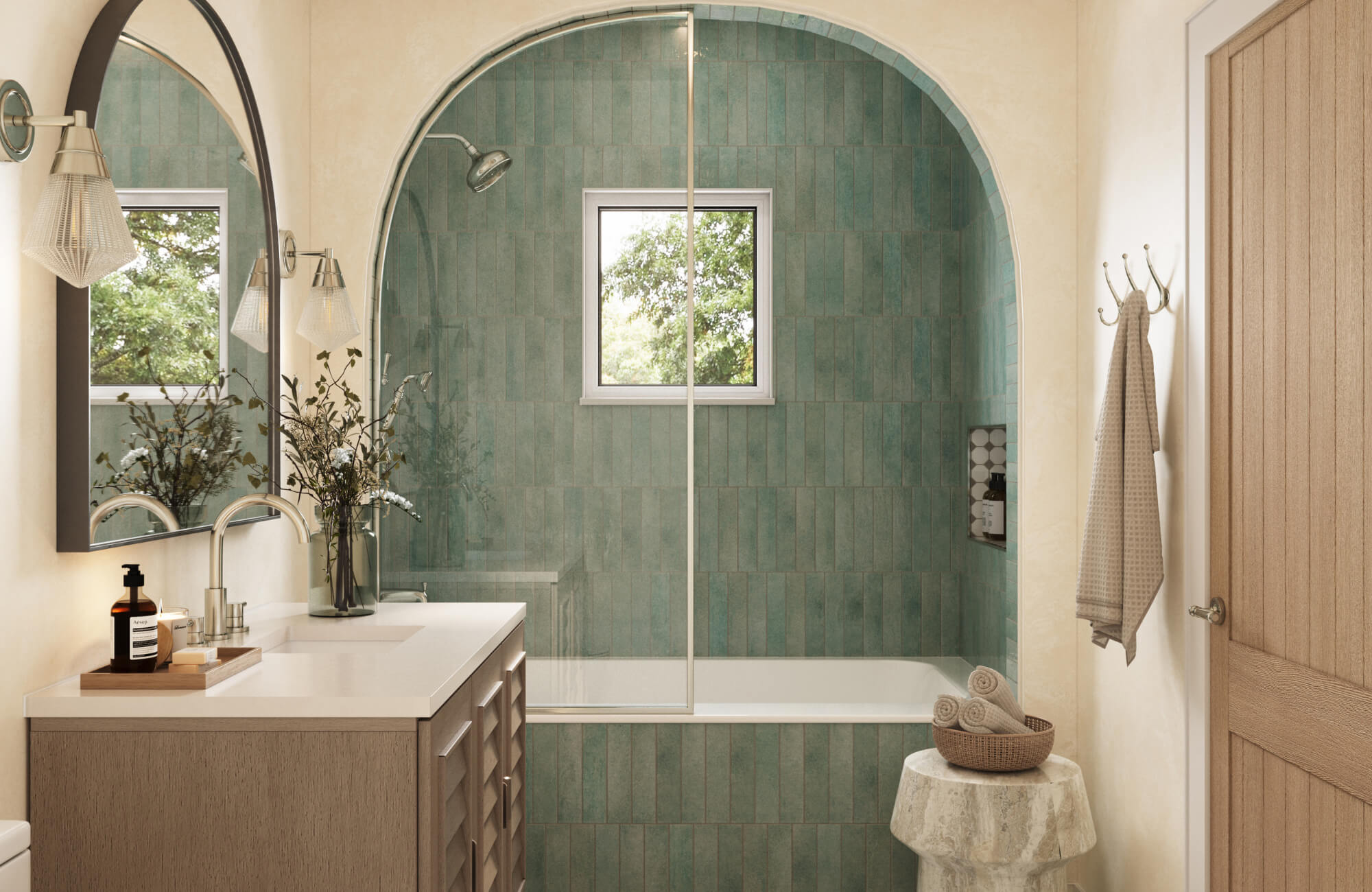 null Bathroom with arched shower opening and arched mirror over a vanity, showing harmonious spacing between curves, fixtures, and wall surfaces.