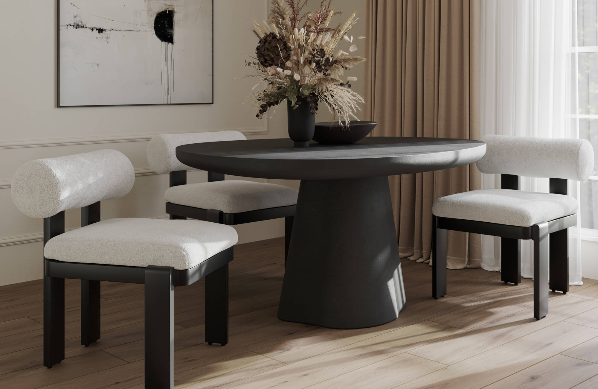 Round black dining table surrounded by cushioned chairs with dark wood frames, set on warm wood flooring with abstract wall art and neutral drapery.
