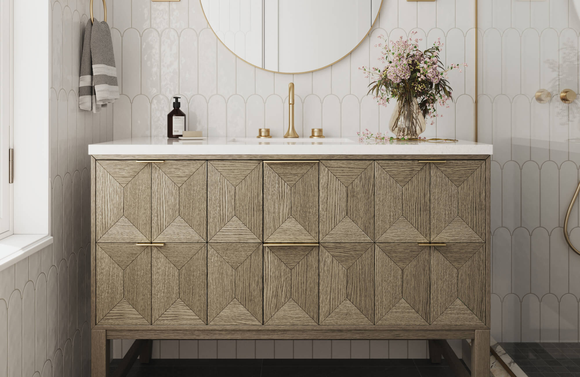 Geometric wood-front vanity with white countertop and brass faucet, styled in a bright bathroom with arched white tile, black flooring, and floral decor.