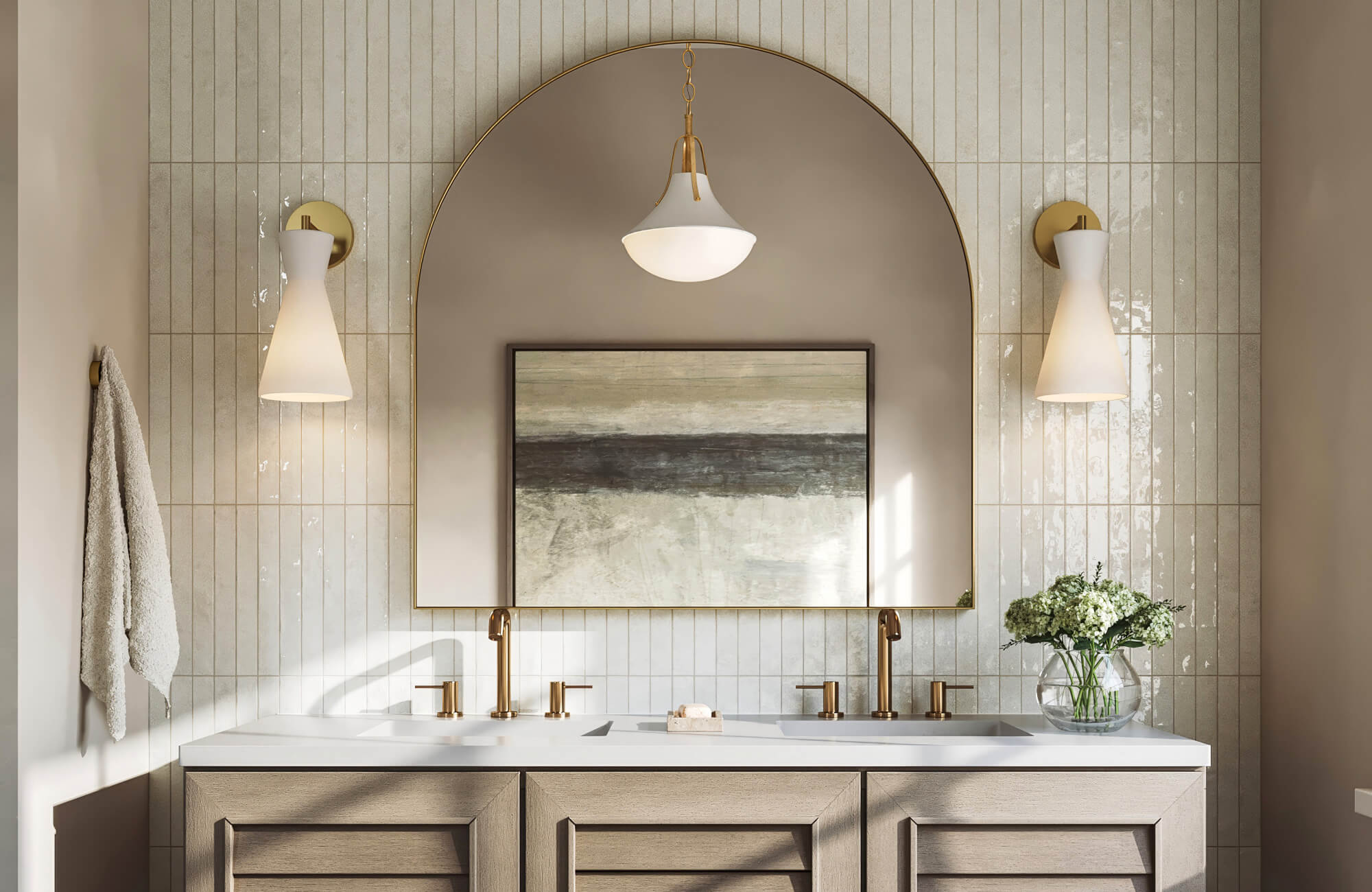 Arched brass bathroom mirror mounted over a double sink vanity, showing how surrounding lighting fixtures interact with the mirror surface and tiled wall backdrop.