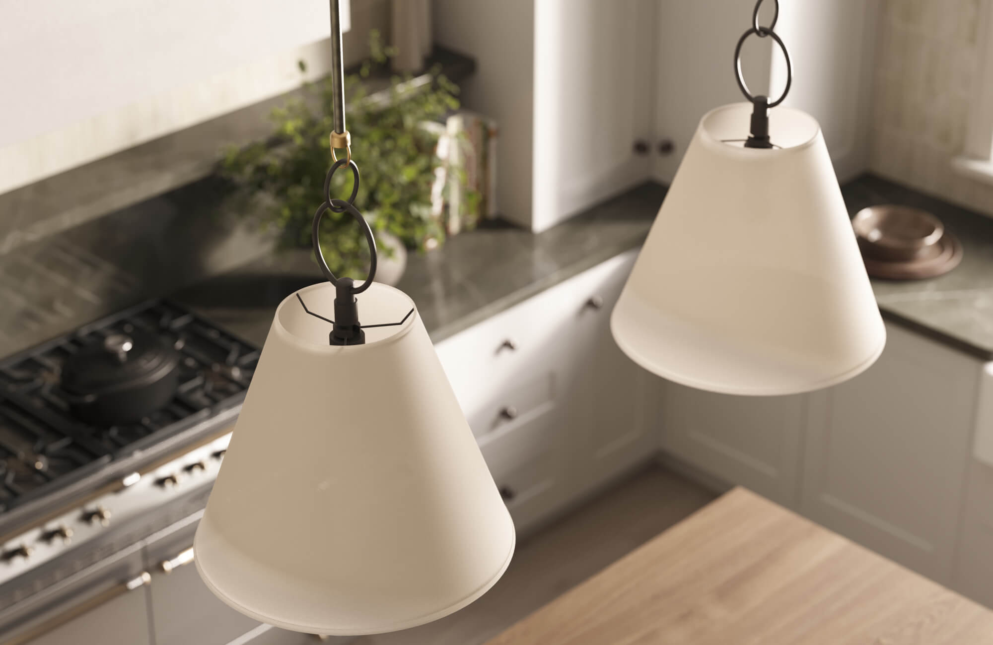 Pair of cone-shaped pendant lights in soft beige tones, bringing warm, focused lighting to a contemporary kitchen.
