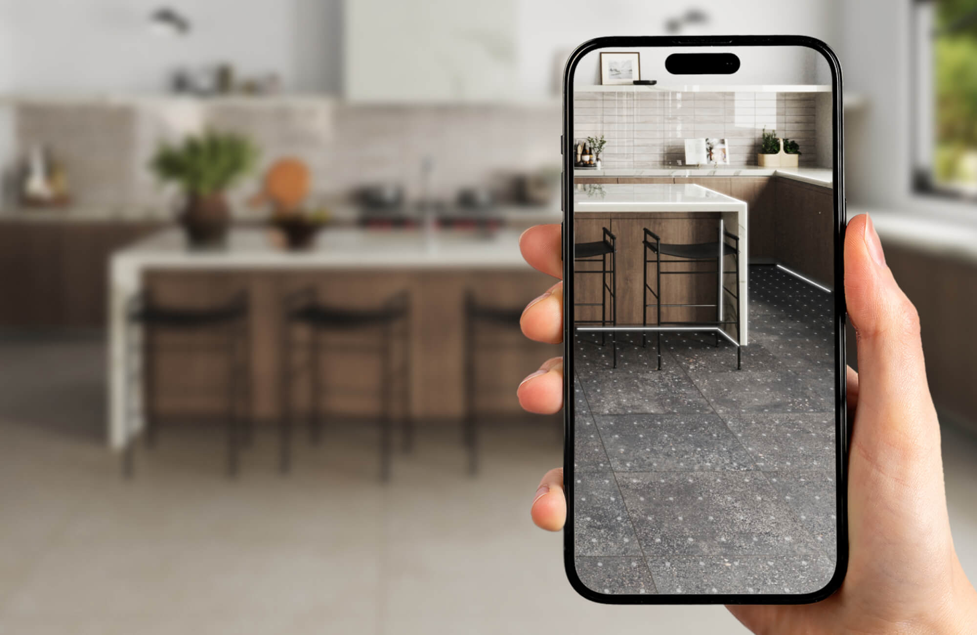 null Augmented reality tool previewing marble look floor tiles in a modern kitchen setting using a smartphone.