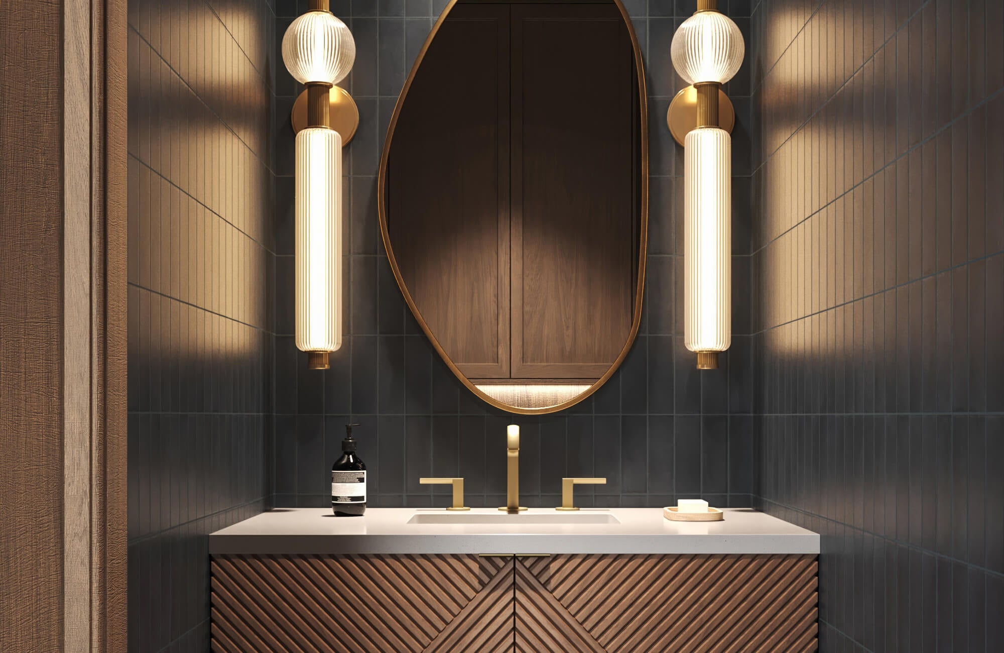 Modern fluted wood vanity and asymmetrical mirror illuminated by glowing vertical glass sconces.