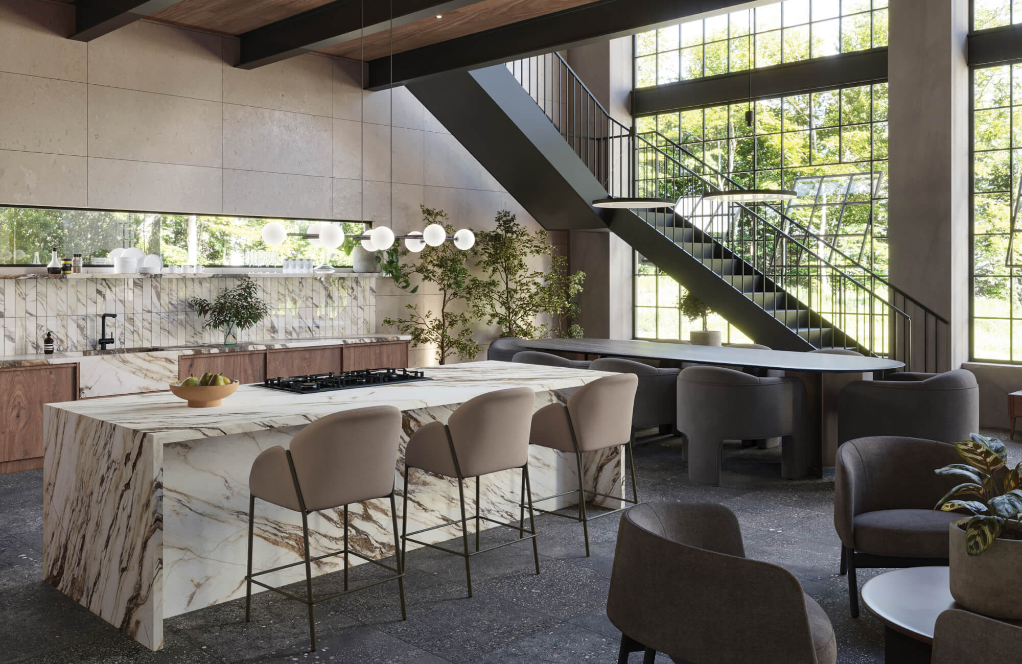 Modern open-plan kitchen with a dramatic marble island, globe pendant lights, and tall windows that flood the space with natural light beneath a steel staircase.