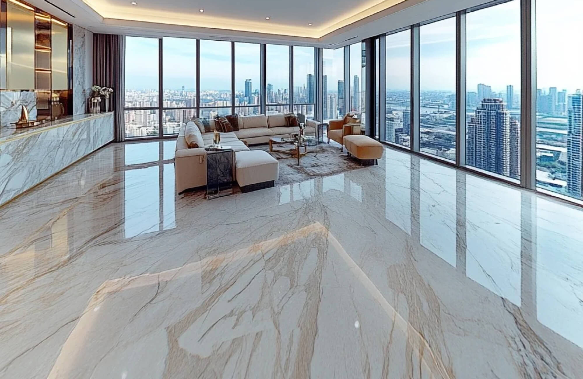 Luxurious penthouse with polished marble floors, panoramic city views, and a spacious living area featuring modern furnishings.