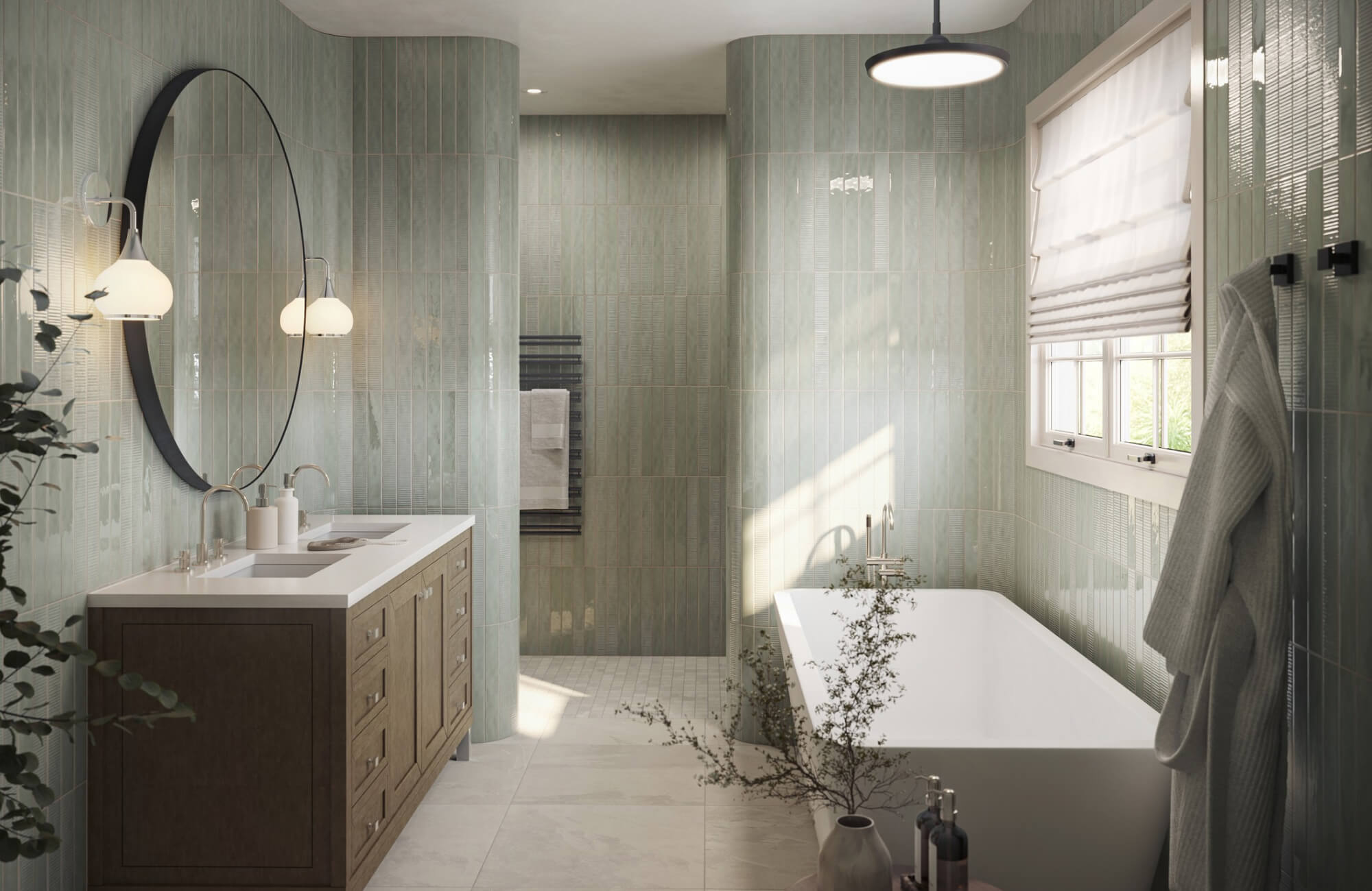 Contemporary spa-inspired bathroom with glossy sage green vertical subway tiles, a dark wood double vanity, oval black framed mirror, globe sconces, and freestanding soaking tub.