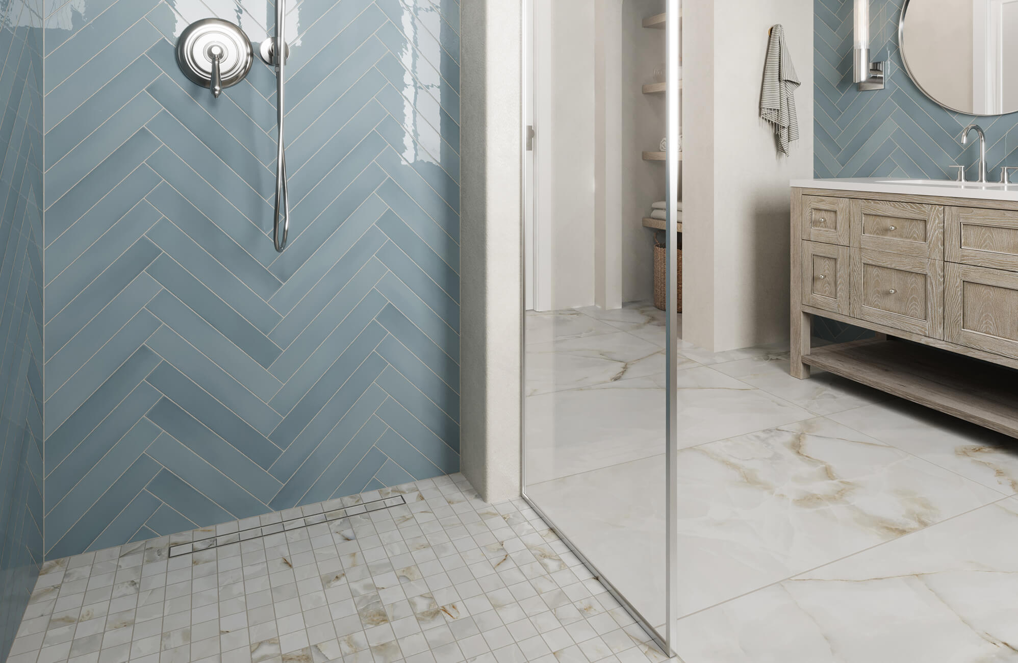 Contemporary bathroom with glossy blue herringbone tile walls that bring vibrant contrast against marble floors and a rustic wood vanity.