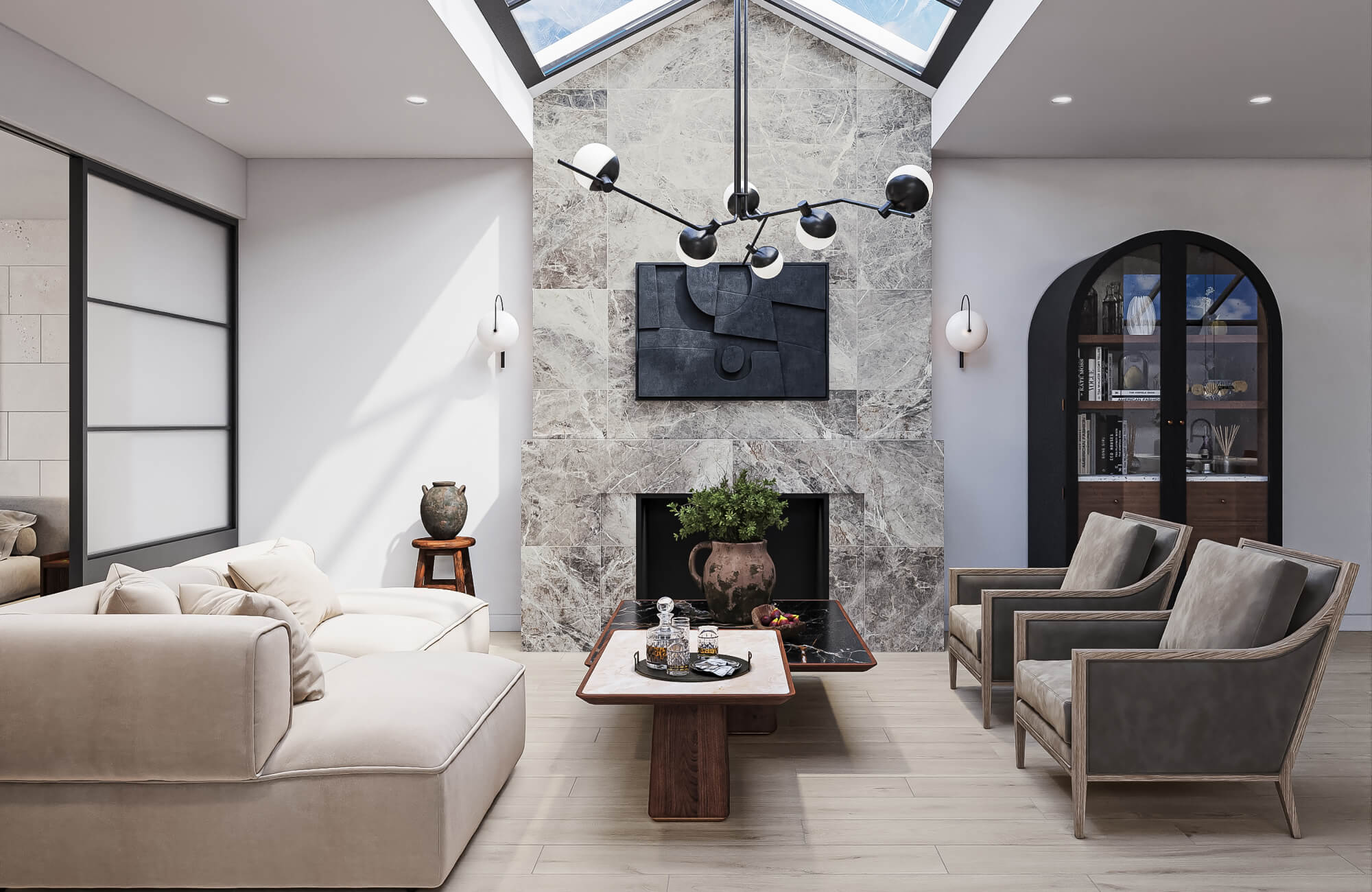 A bright living space featuring a floor-to-ceiling marble fireplace with a minimalist artwork, surrounded by soft neutral furniture and skylights that fill the room with natural light.