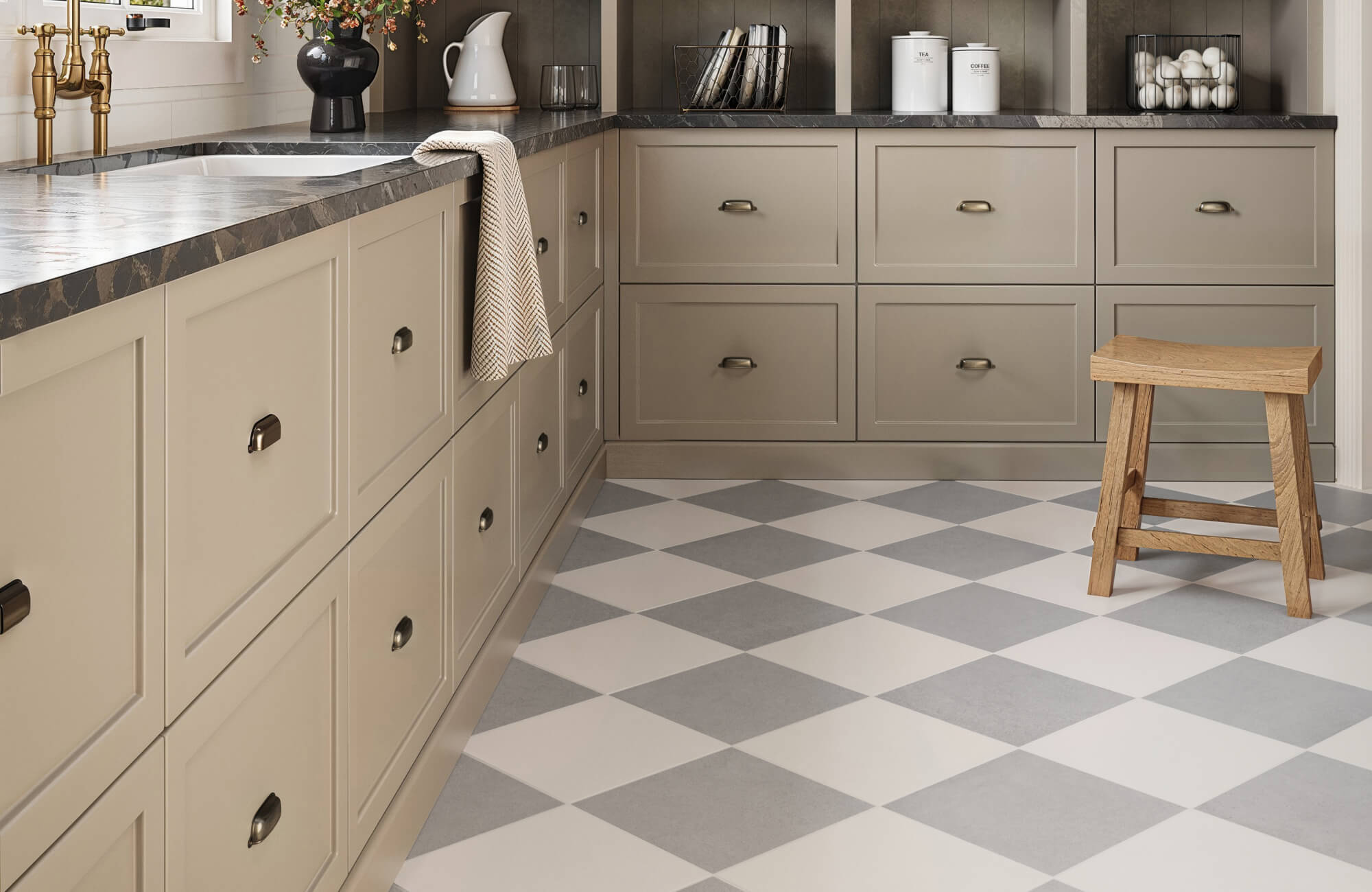 null Charming kitchen featuring beige cabinetry, dark countertops, and a light gray and white checkerboard tile floor, adding a classic touch