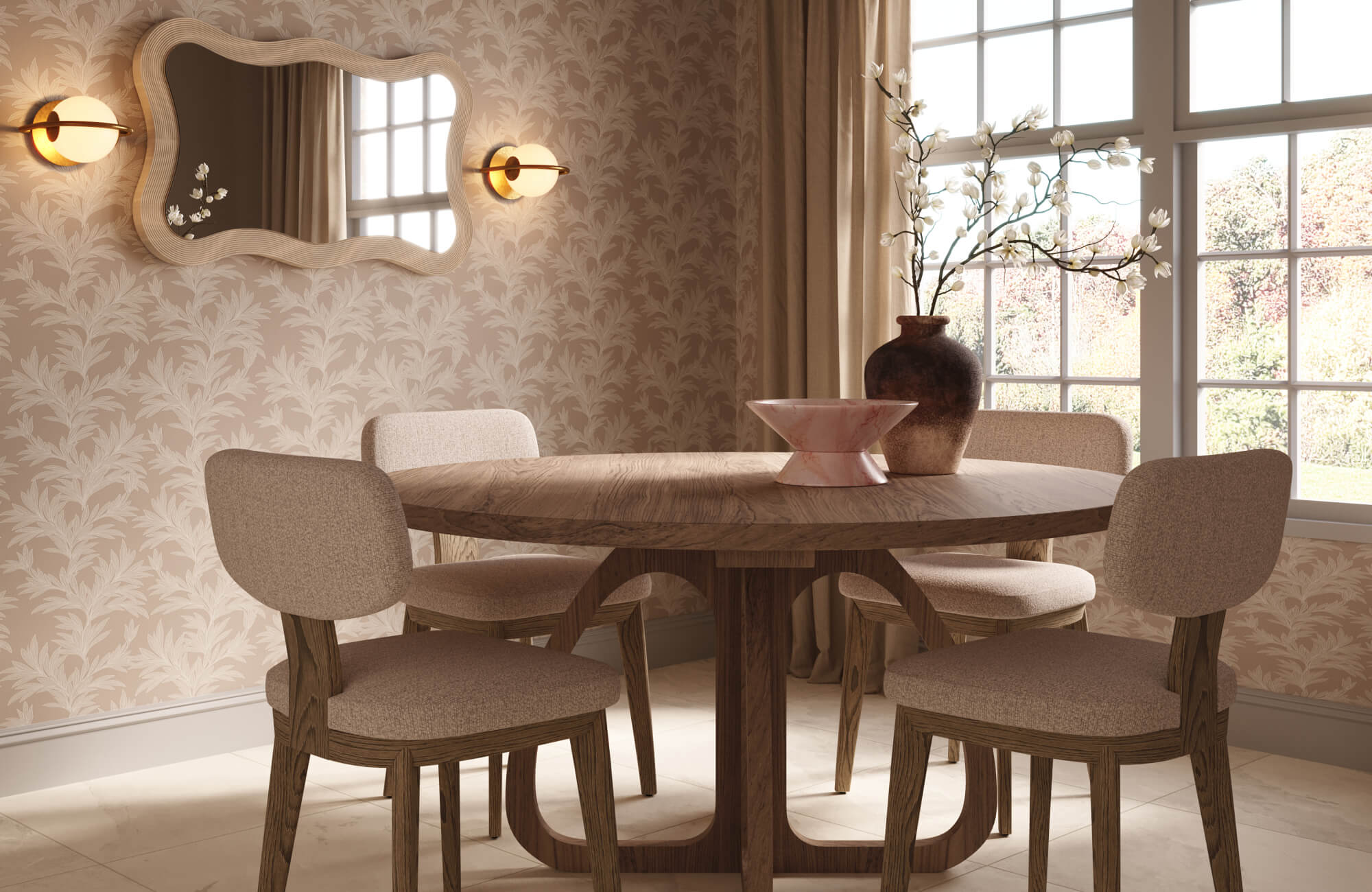 Round wood dining table styled with a pink marble bowl and dark ceramic vase with white branches in a softly layered dining room with floral wallpaper.