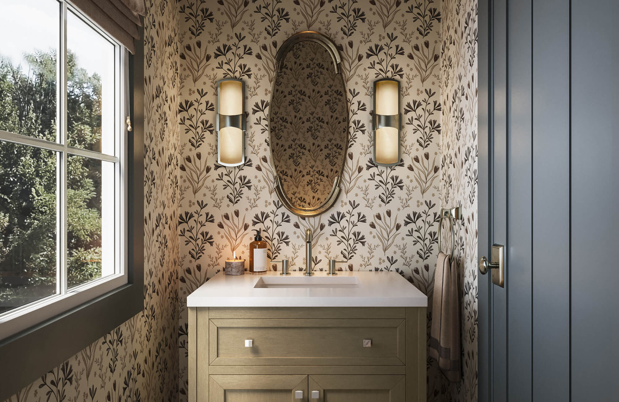 null Powder room with cream and dark brown floral wallpaper, a gold oval mirror, two warm cylinder sconces, and an olive green vanity with a white countertop.