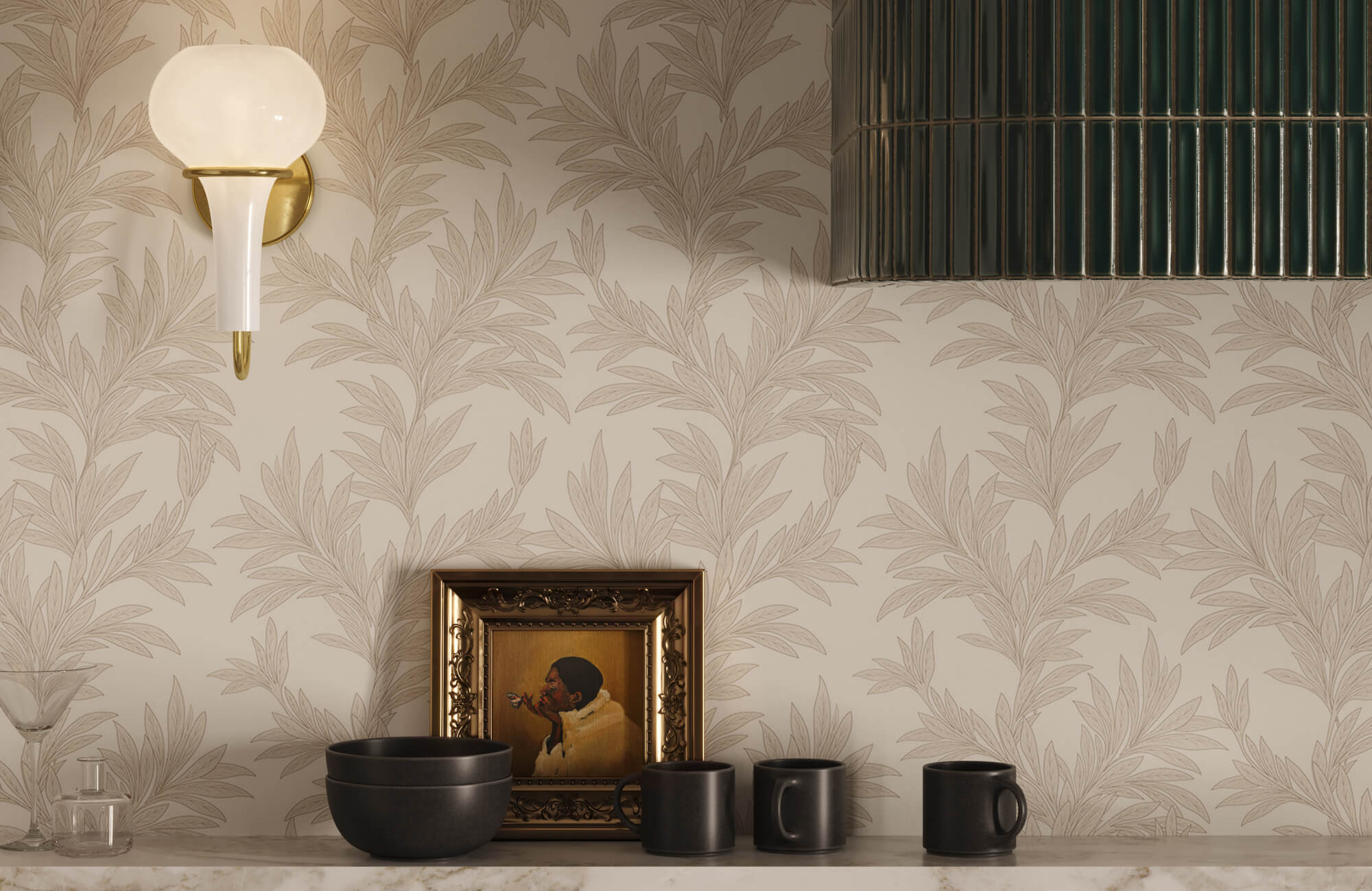 null A soft beige botanical leaf wallpaper backdrops a marble countertop with black ceramic bowls and mugs, an ornate gold-framed portrait, and a white globe gold sconce above.